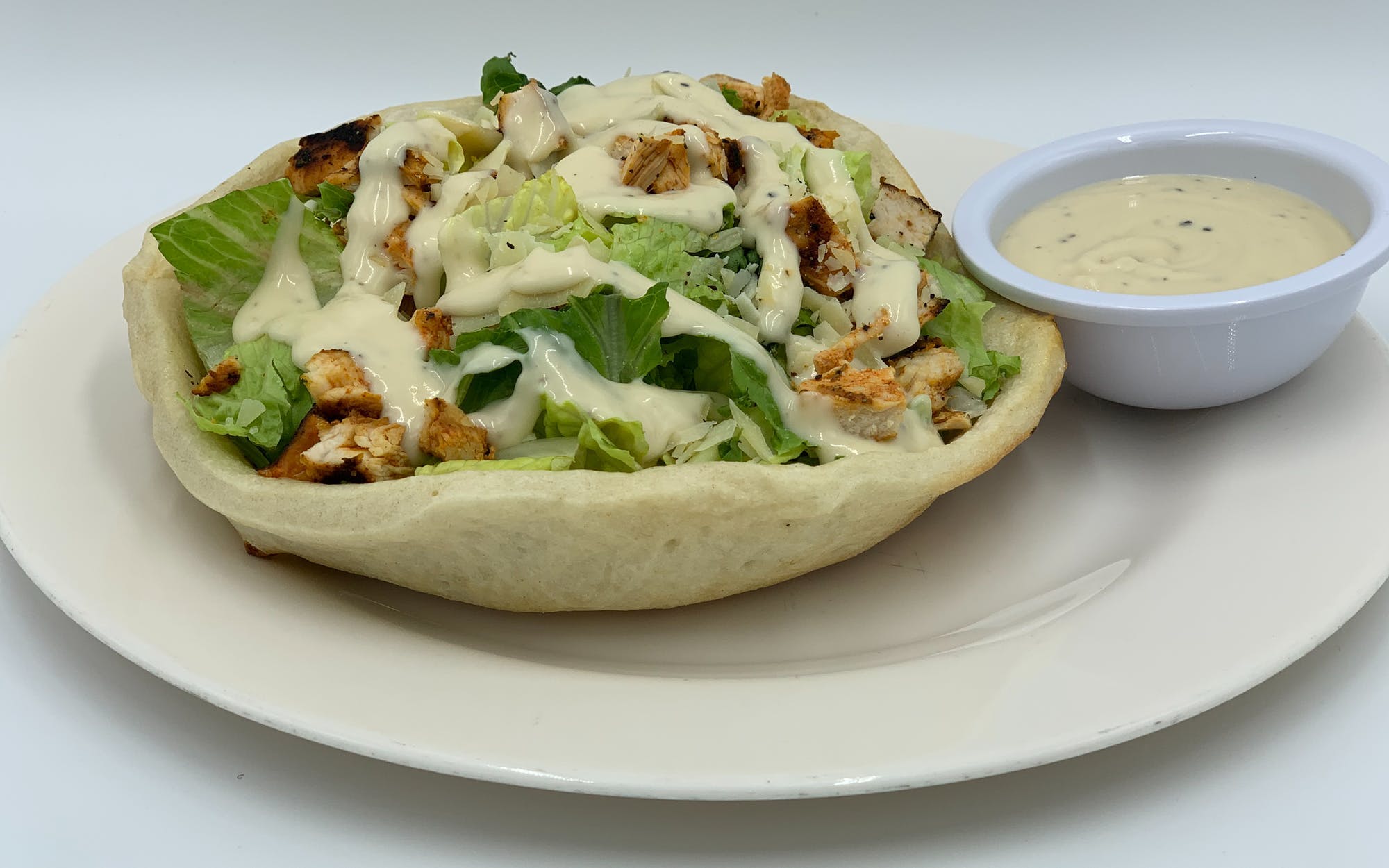 Order Caesar Salad Bread Bowl with Chicken - Salad food online from Mario Pizza store, Westbury on bringmethat.com