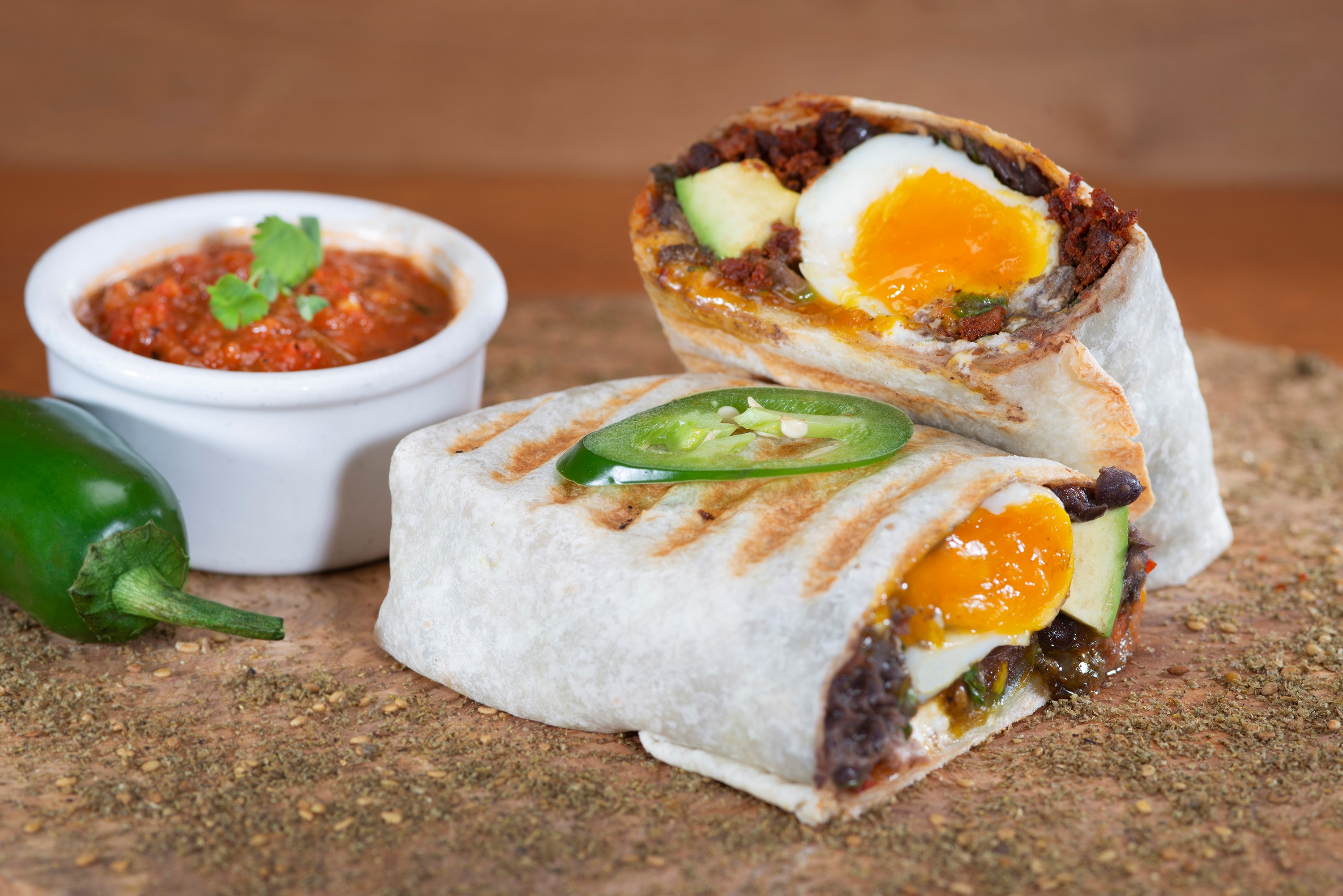 Order Huevos Rancheros Burrito food online from Urth Caffe store, Orange on bringmethat.com
