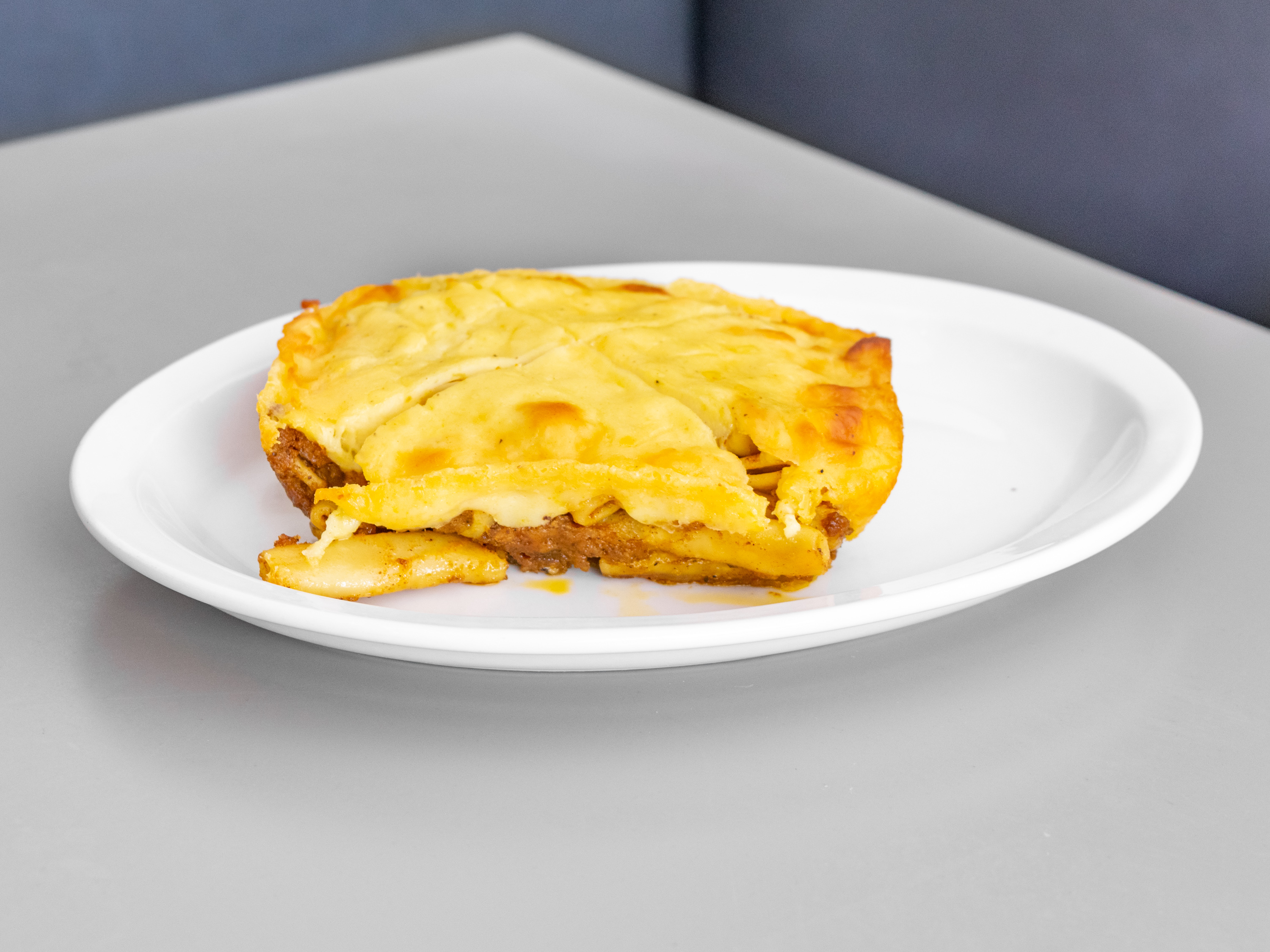Order Pastitsio food online from Leo Coney Island On Tap (122 Oakes St Sw store, Grand Rapids on bringmethat.com