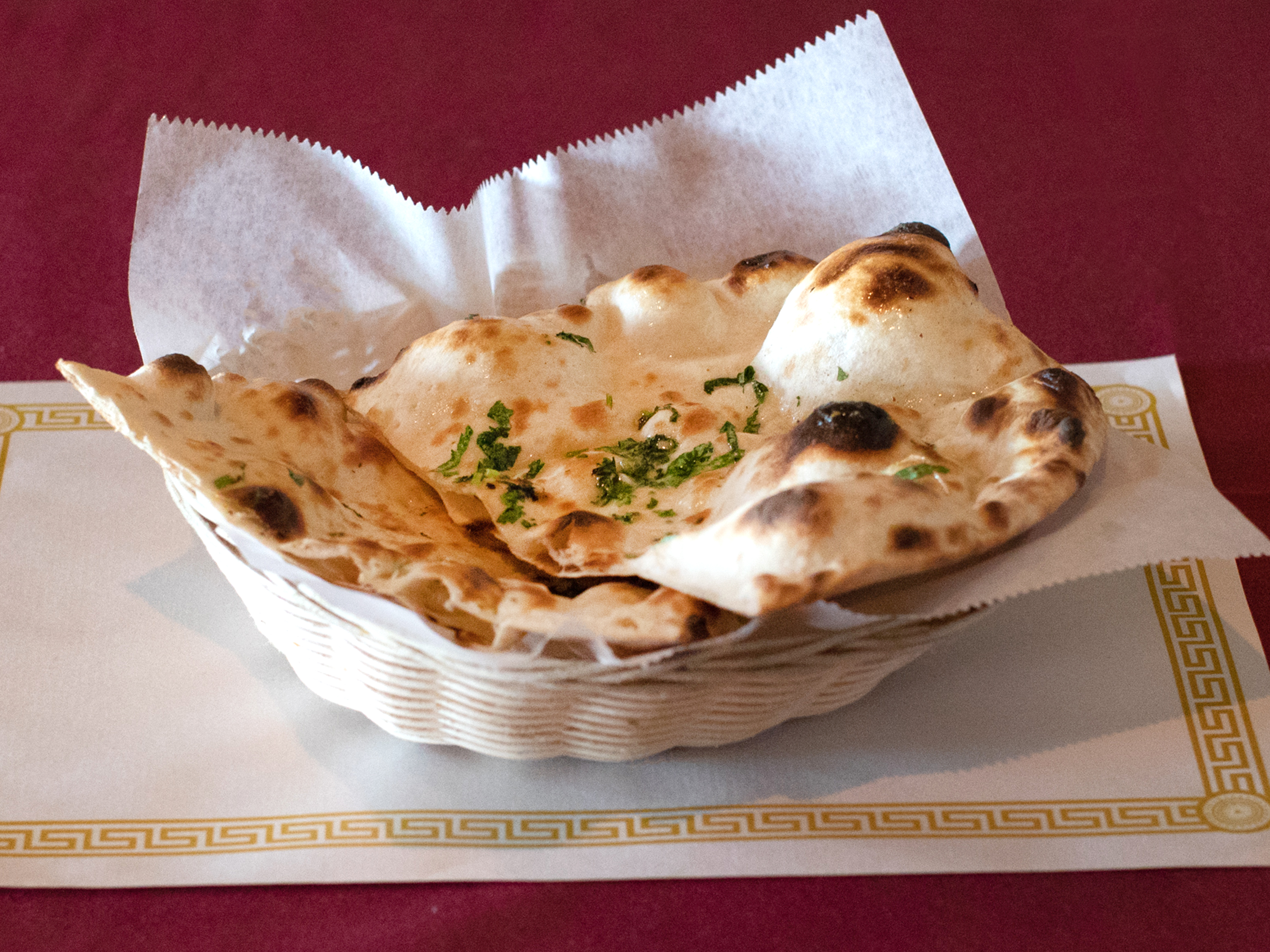 Order 82. Garlic Naan food online from India Palace store, Memphis on bringmethat.com
