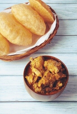 Order Poori Chicken Curry food online from Peacock Indian Cuisine store, Plano on bringmethat.com
