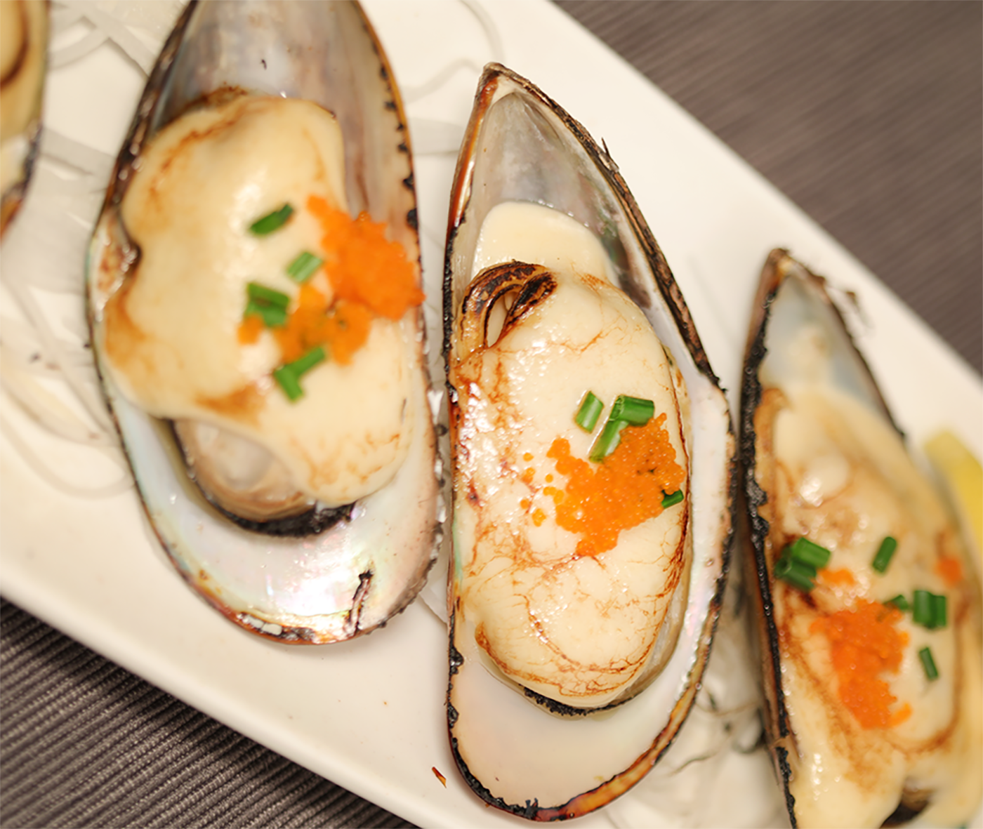 Order Baked Mussels on 1/2 Shell (6pcs) food online from Ise Sushi Japanese Restaurant store, Placentia on bringmethat.com