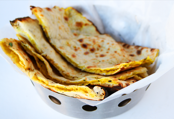 Order Aloo Naan food online from Saffron Indian Bistro store, Tucson on bringmethat.com