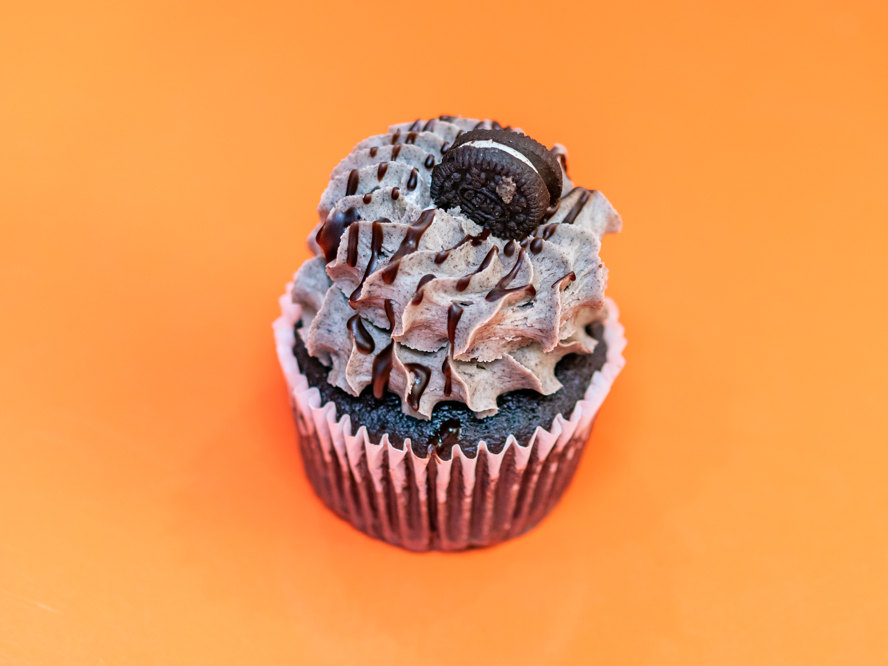Order Cookies and Cream Cupcake food online from Gigi's Cupcakes store, Omaha on bringmethat.com