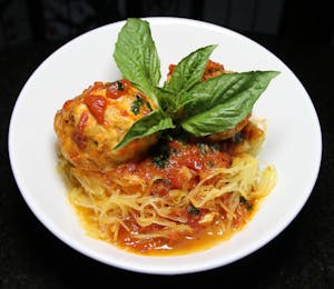 Order Chicken Meatballs over Spaghetti Squash food online from Marco Polo's store, Westbury on bringmethat.com