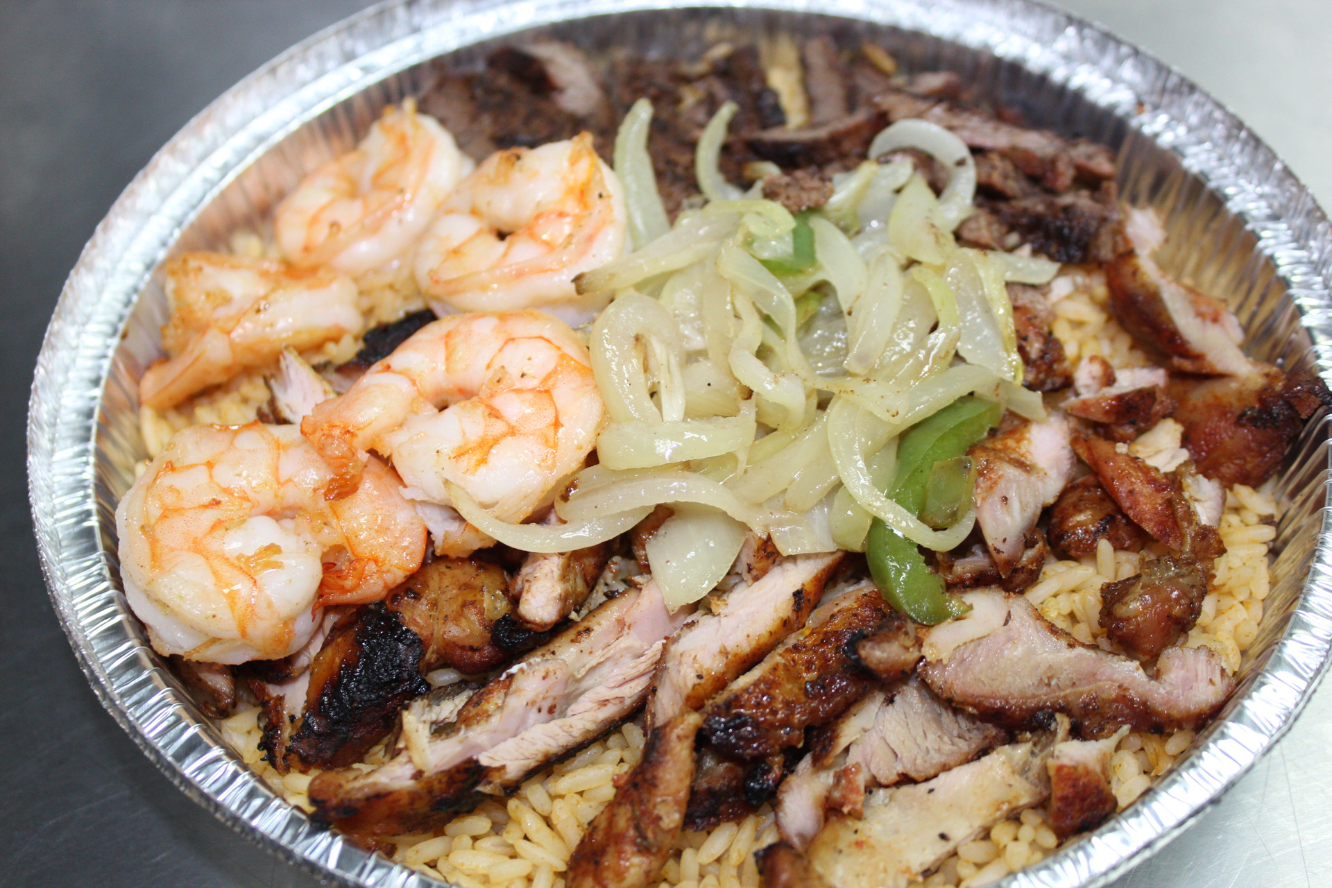 Order 75. Mexican Rice with Chicken, Steak and Shrimp food online from Yummy Taco store, Inwood on bringmethat.com