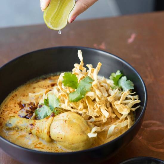 Order Khao Soi D. food online from Otus Thai Kitchen & Coffee store, West Hollywood on bringmethat.com
