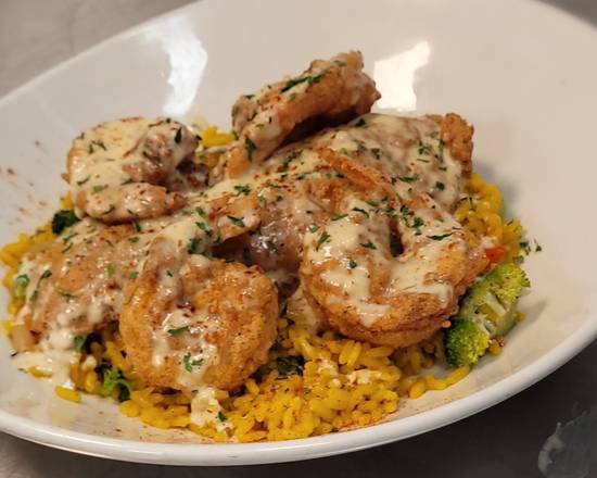 Order Fried catfish yellow rice bowl food online from KREJUNS store, Cleveland on bringmethat.com