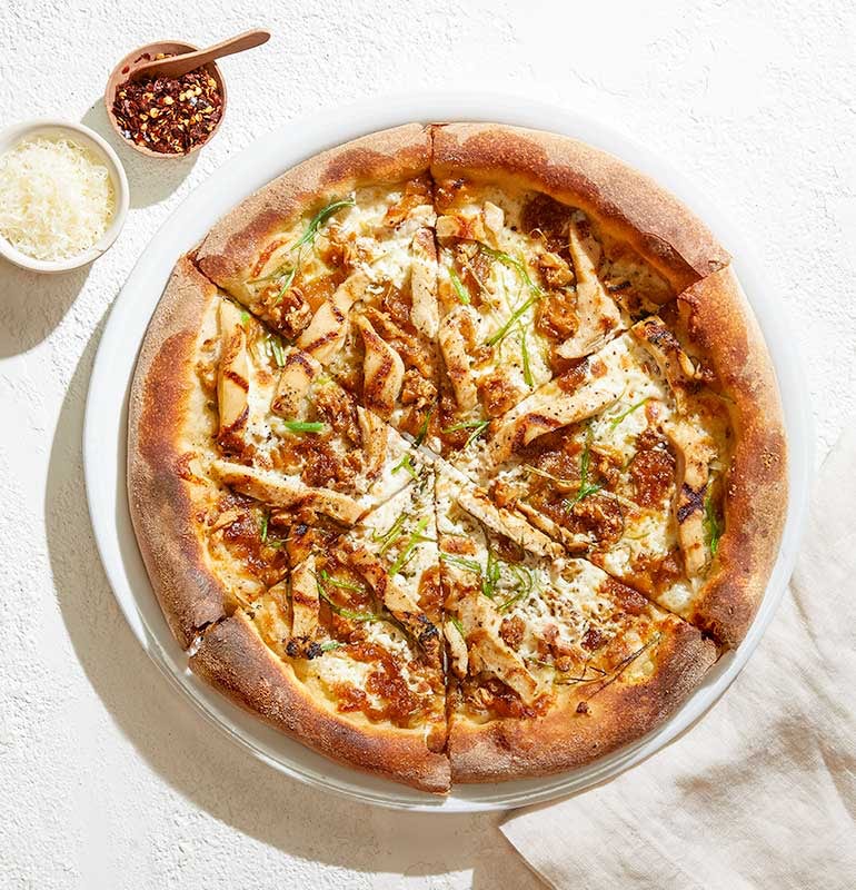 Order ROASTED GARLIC CHICKEN food online from California Pizza Kitchen store, Hollywood on bringmethat.com
