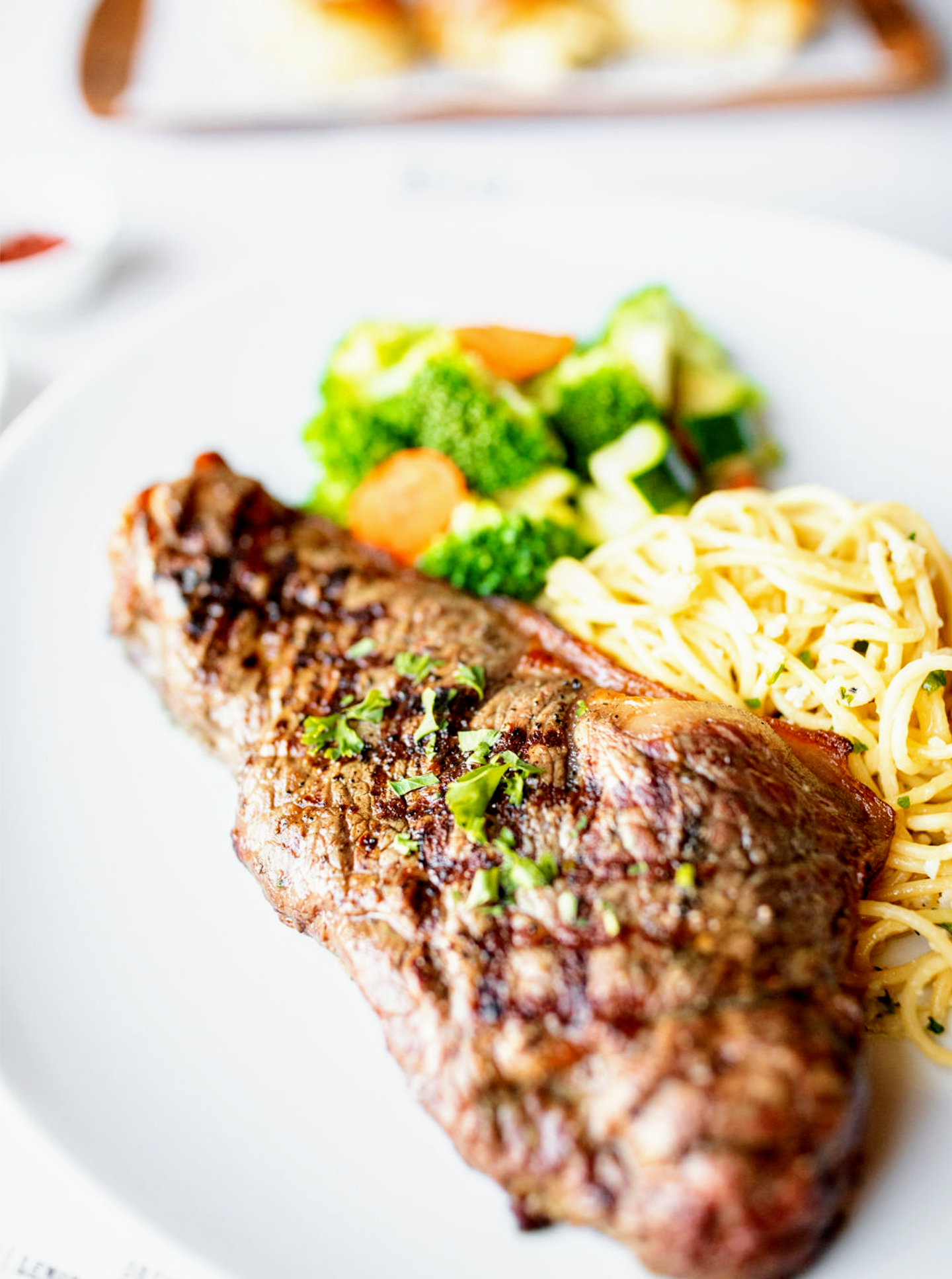 Order GRILLED NY STEAK food online from Ma Italian Kitchen store, Burbank on bringmethat.com