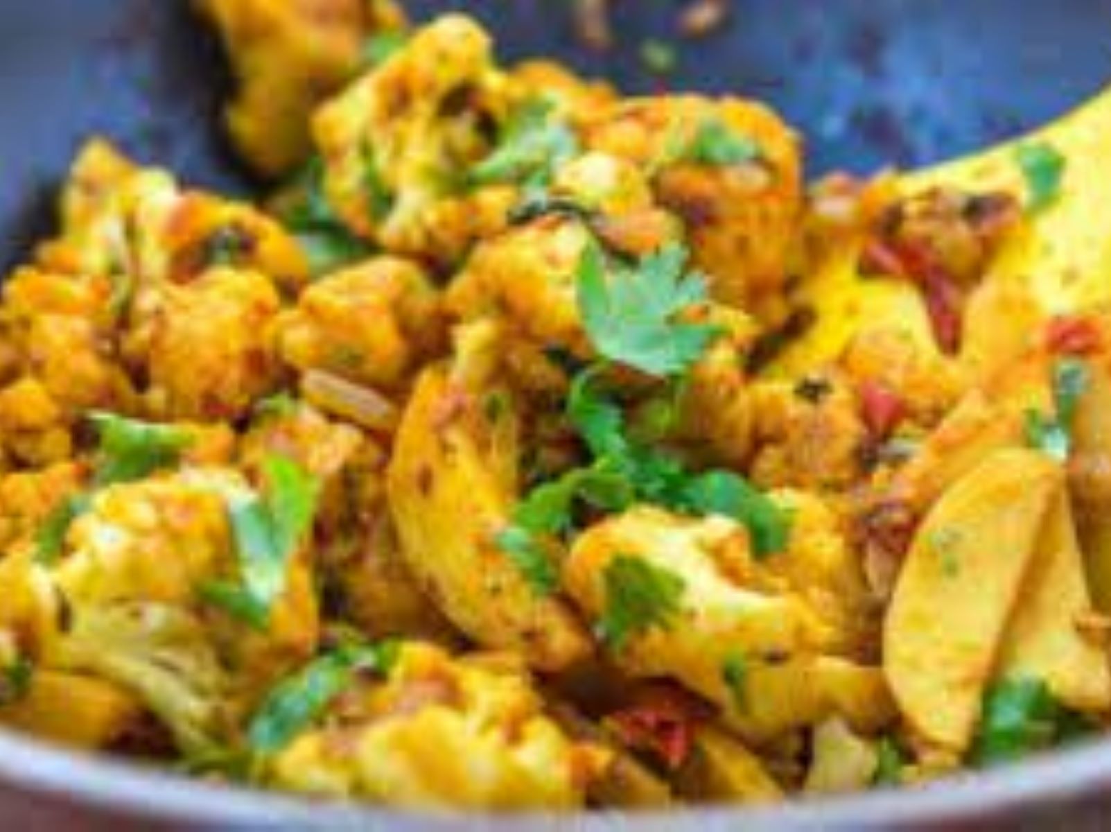 Order Aloo Gobhi food online from Passage to India store, Cambridge on bringmethat.com