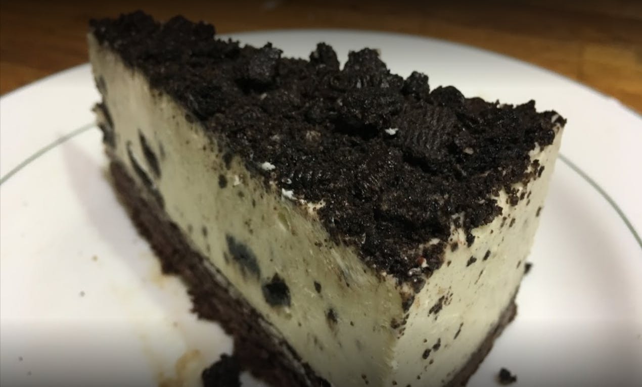 Order Oreo Mousse Cake - Dessert food online from Gabriella's Family Pizza store, Flushing on bringmethat.com