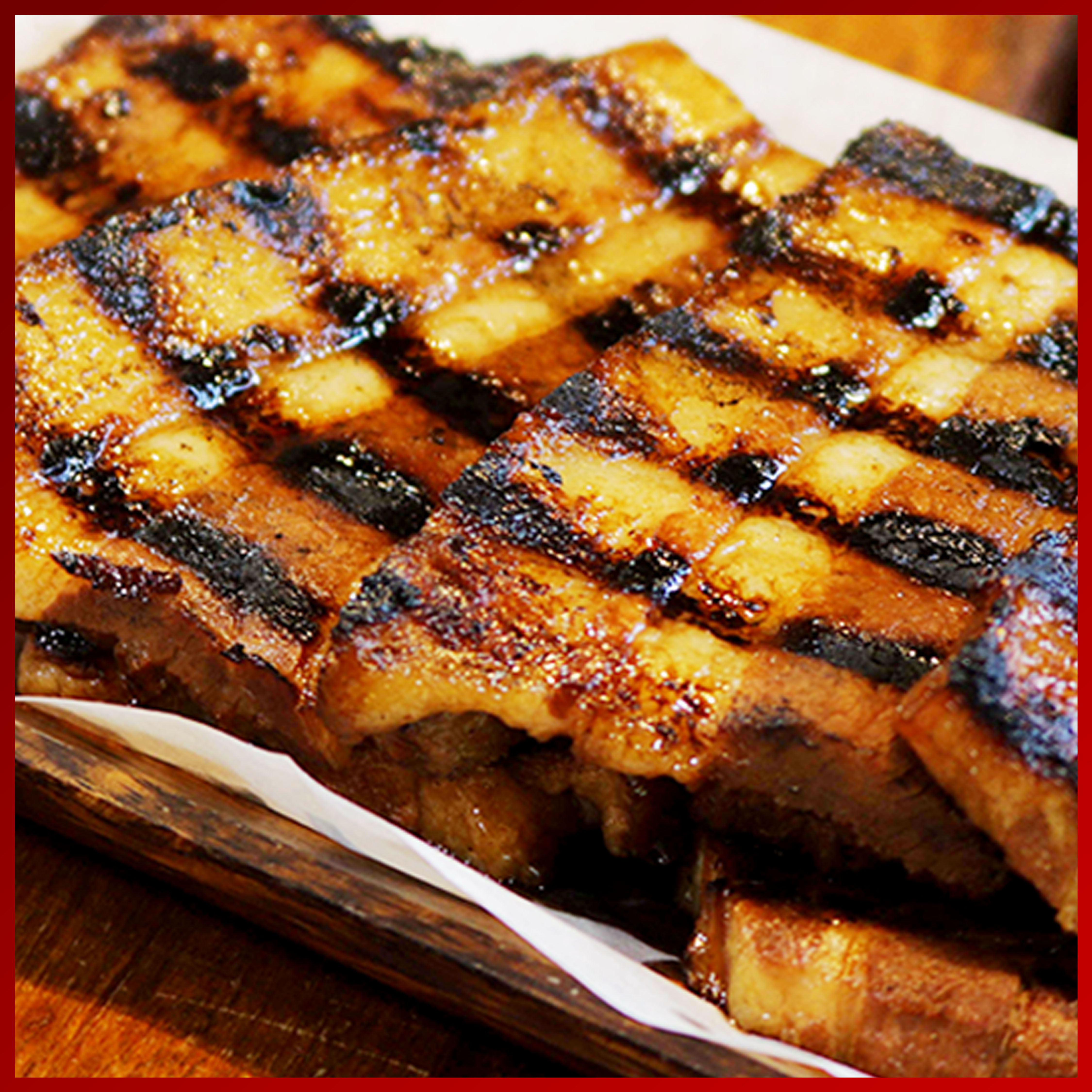 Order Grilled Liempo food online from Isla Restaurant store, San Bruno on bringmethat.com