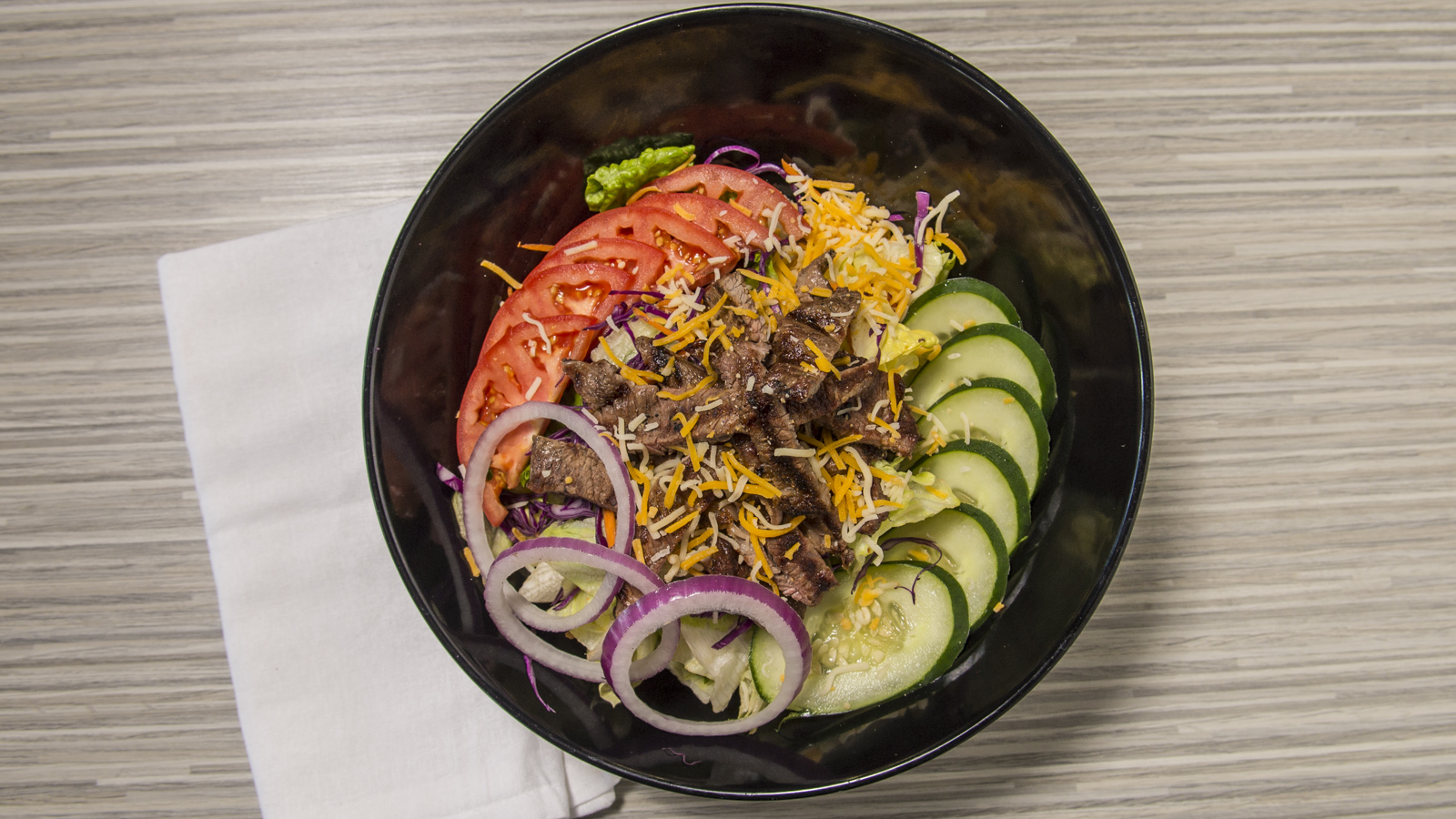 Order Steak Salad food online from OC Burgers store, Fort Worth on bringmethat.com