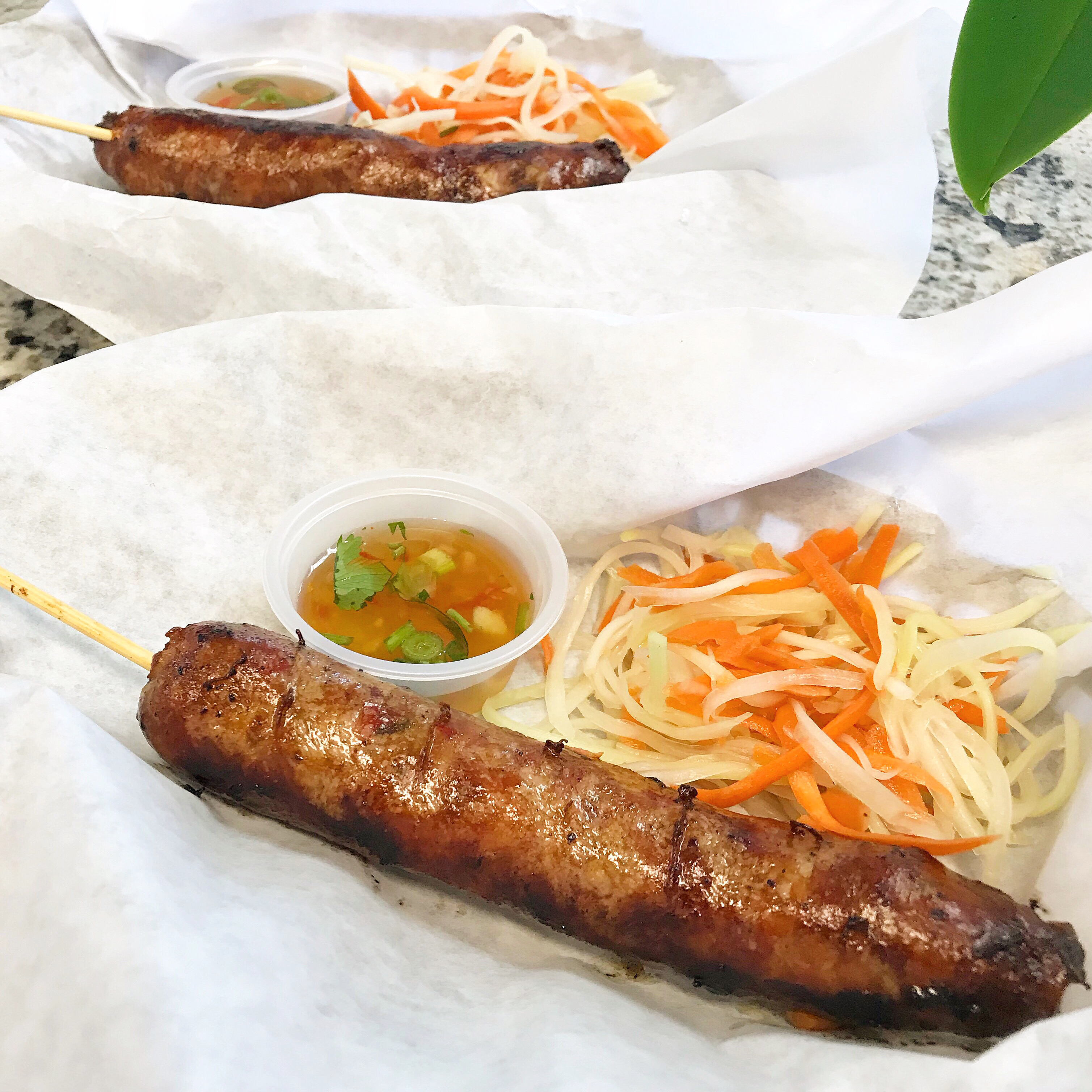 Order 10. Lao Pork Sausage (2) food online from Sea Bowl store, Elk Grove on bringmethat.com
