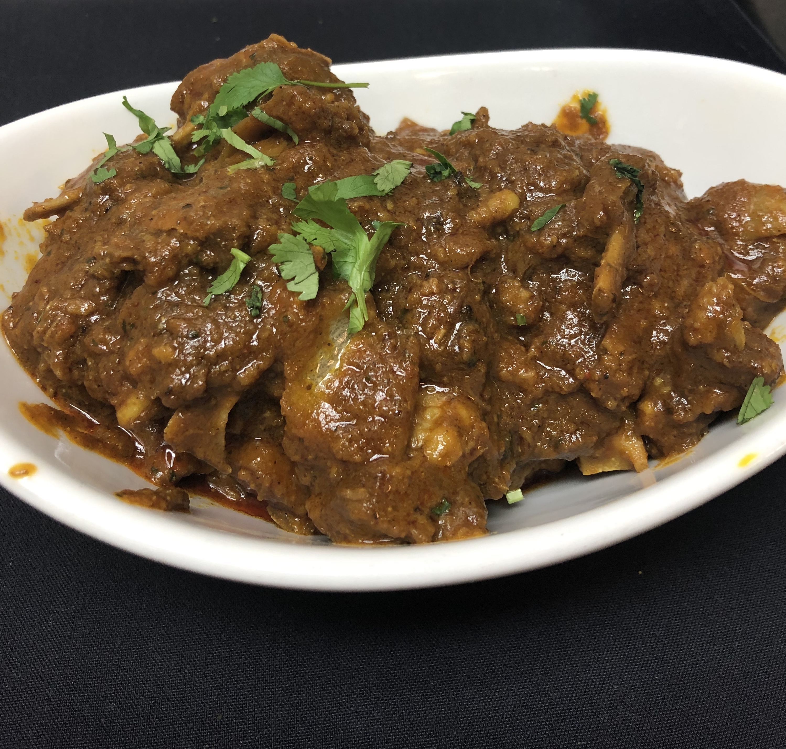 Order Handi Goat Masala food online from Indish Exotic Indian Restaurant Bar store, Brandywine on bringmethat.com