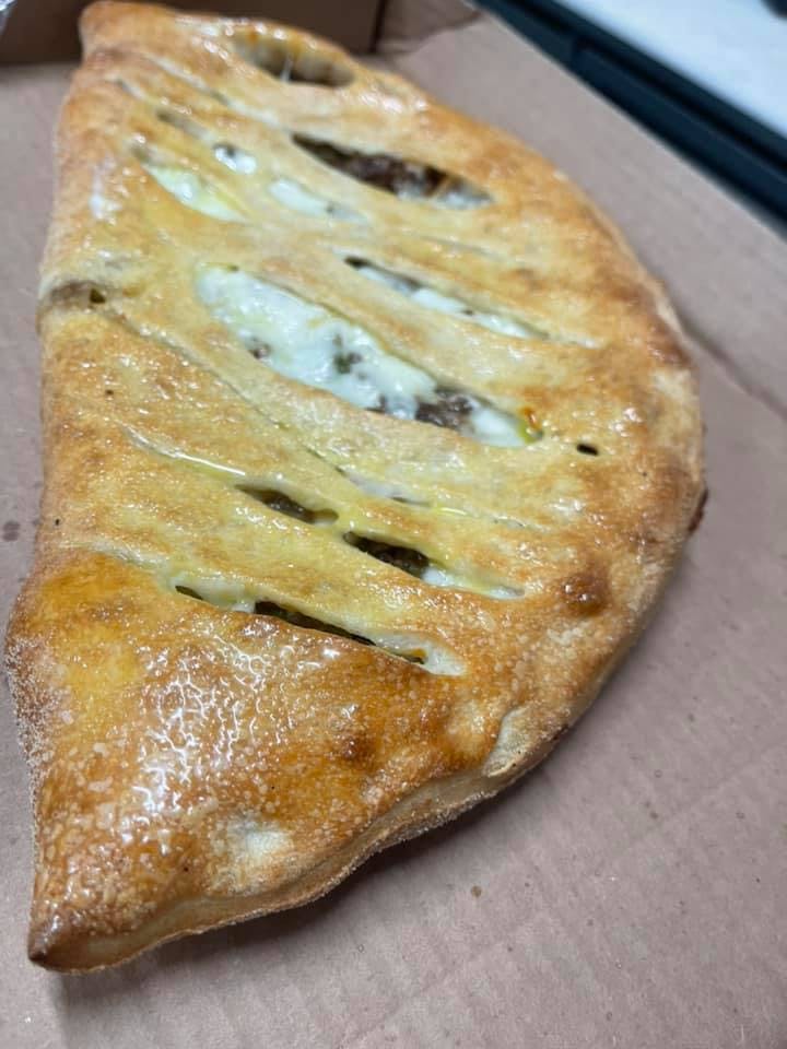 Order Four Cheese Calzone - 10" food online from Twins Pizza store, Dublin on bringmethat.com