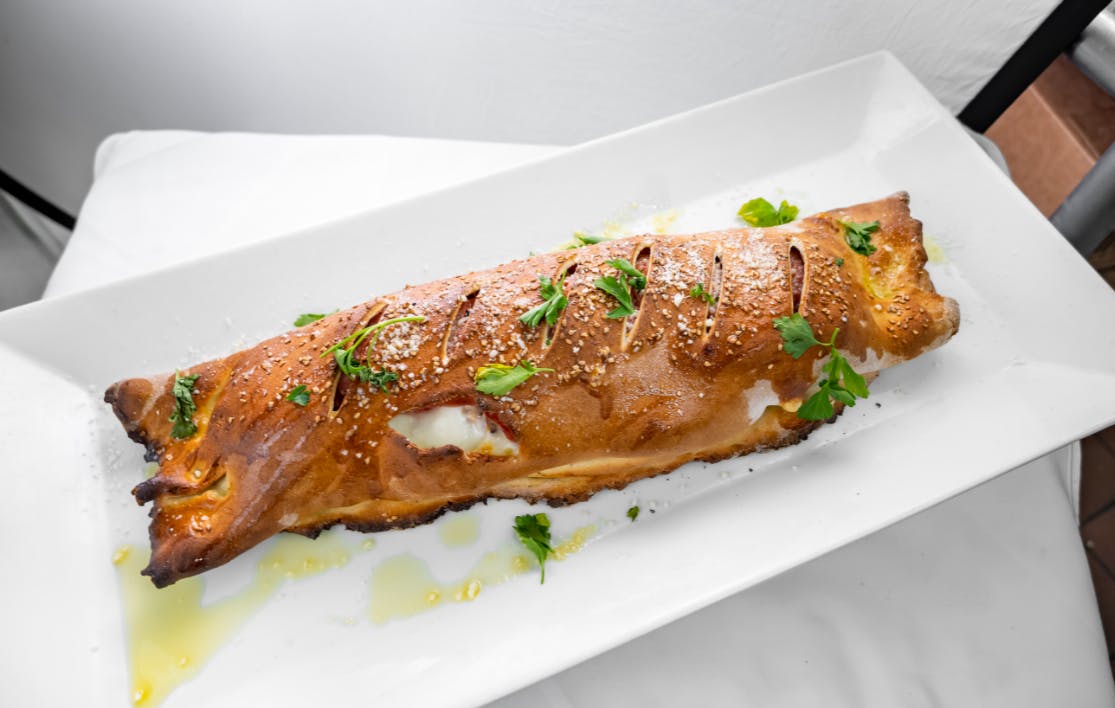 Order Traditional Stromboli Lunch - Small food online from Alessios Seafood Grille store, Warrington on bringmethat.com