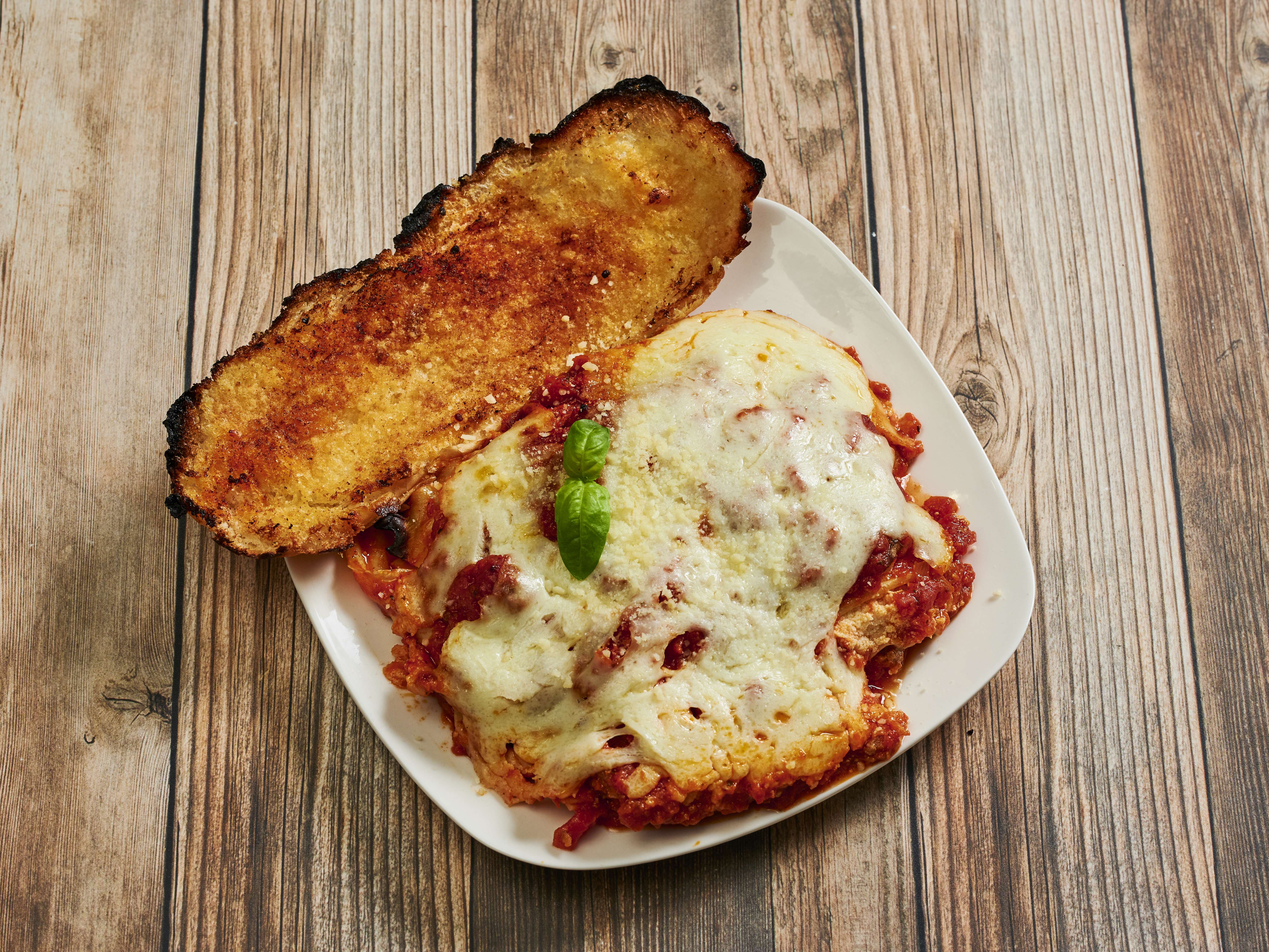 Order Lasagna Dinner food online from Pizza Guy store, Studio City on bringmethat.com