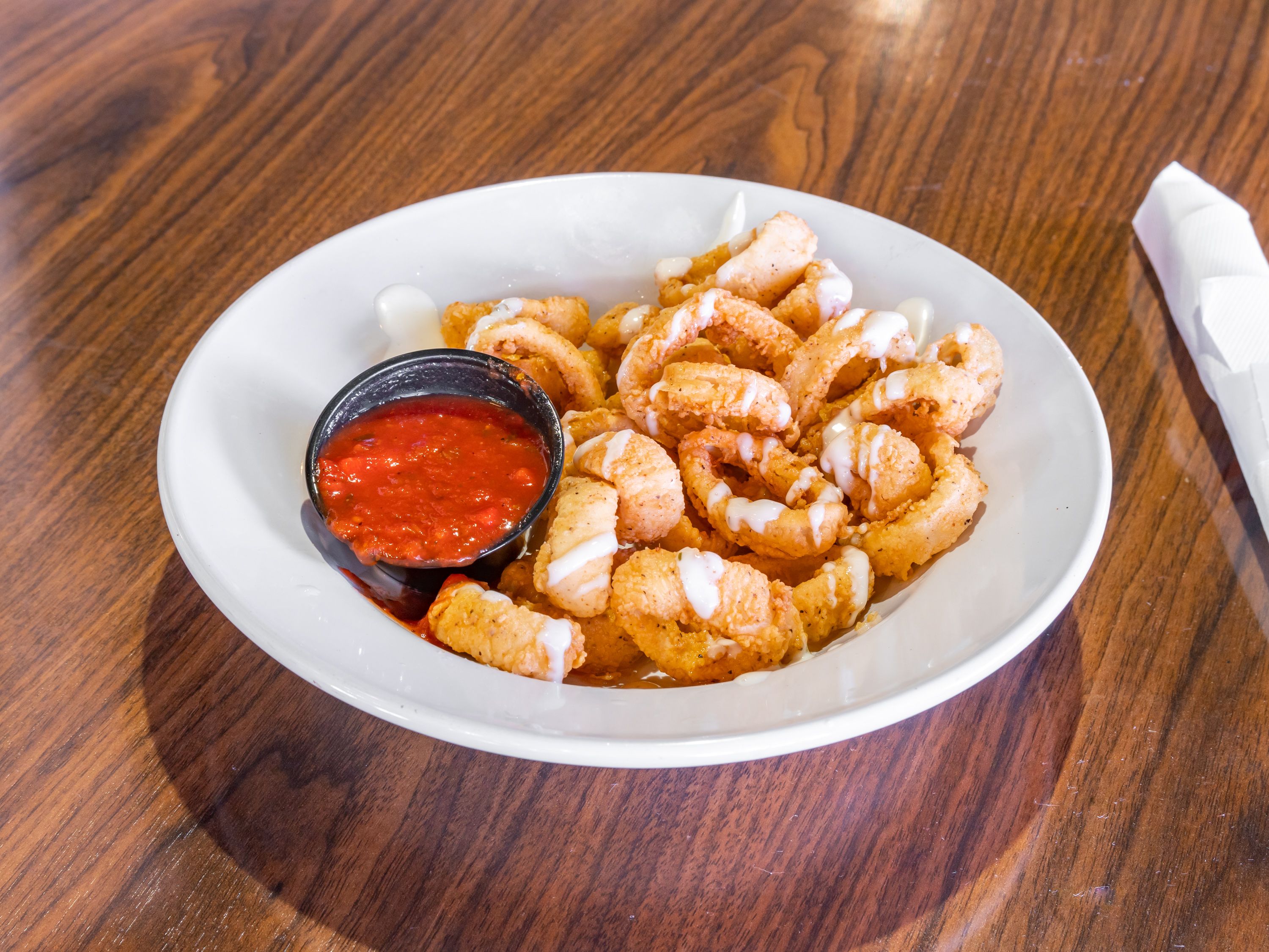 Order Fried Calamari food online from The Standard Restaurant store, Fort Myers on bringmethat.com