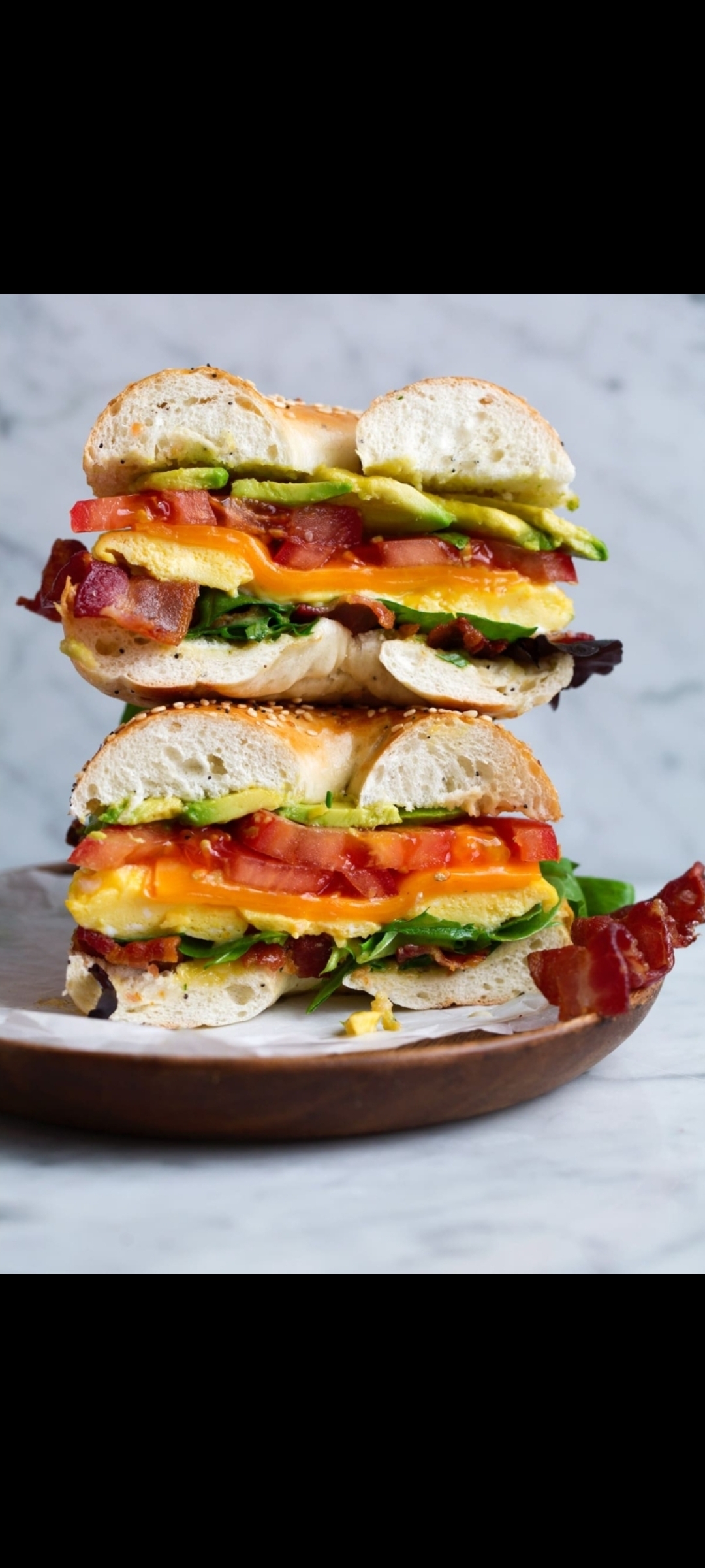 Order Eggs With Nova Smoked Salmon Avocado Tomatoes Cheese & Spinach Sandwich  food online from American Gourmet Foods Deli store, New York on bringmethat.com
