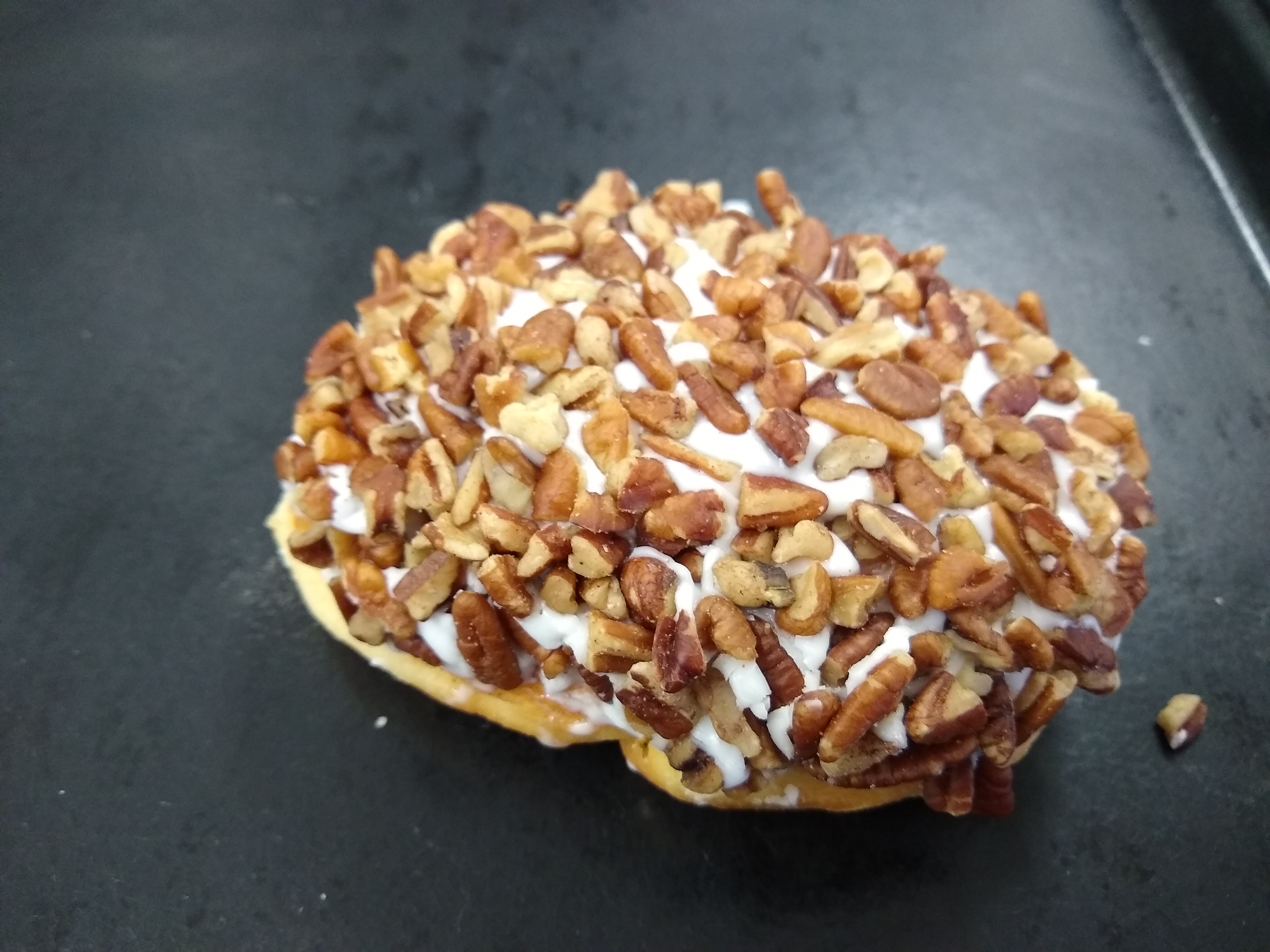 Order Vanilla Iced Pecan Roll food online from Mary Ann Donuts store, North Canton on bringmethat.com