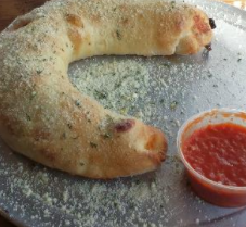Order Calzone food online from Famulari's Pizzeria store, Summerville on bringmethat.com