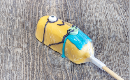 Order Dipped Twinky Minion Blue food online from Rocky Mountain Chocolate Factory store, Logan on bringmethat.com