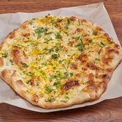 Order Garlic Naan food online from Namaste Curry House store, San Francisco on bringmethat.com