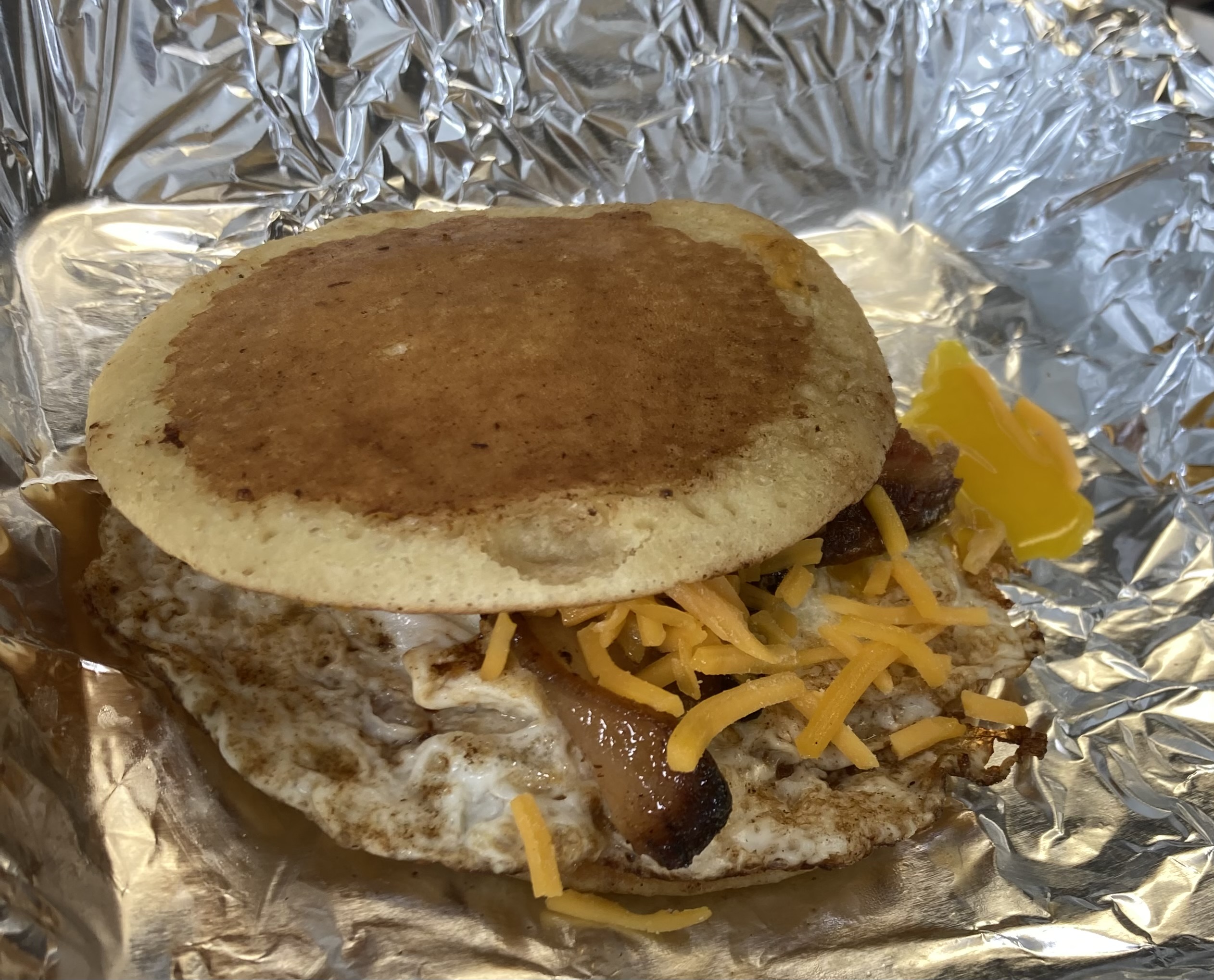 Order Pancake Breakfast Sandwich, Bacon Egg and Cheese food online from Beer Bait And Moor store, Sandusky on bringmethat.com