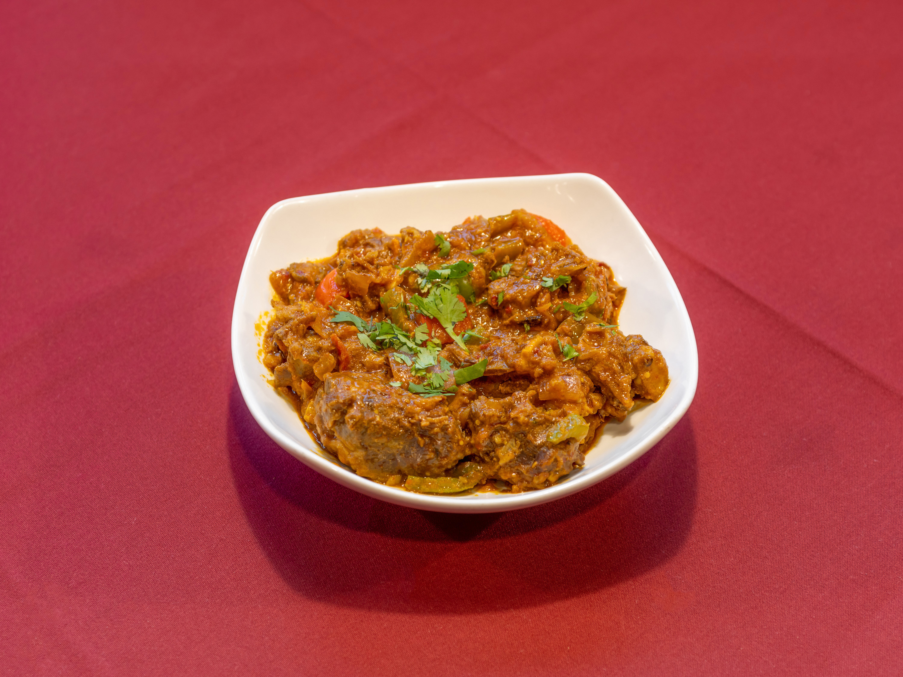 Order Goat Achari food online from Haveli Indian Restaurant store, Saint Louis on bringmethat.com