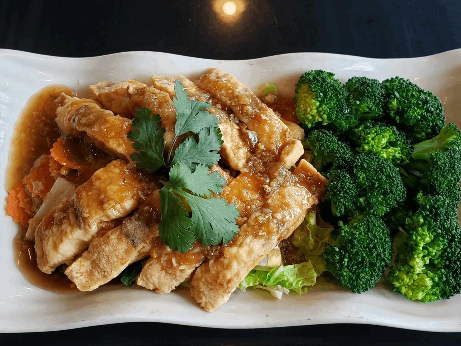 Order Garlic Salmon food online from Thai Thani Kitchen store, Seattle on bringmethat.com