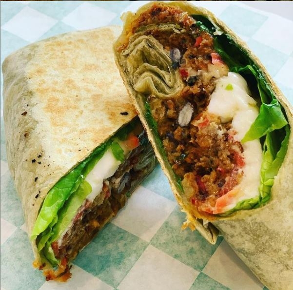 Order BLACK BEAN FETA WRAP food online from Grounded For Life store, Clinton on bringmethat.com