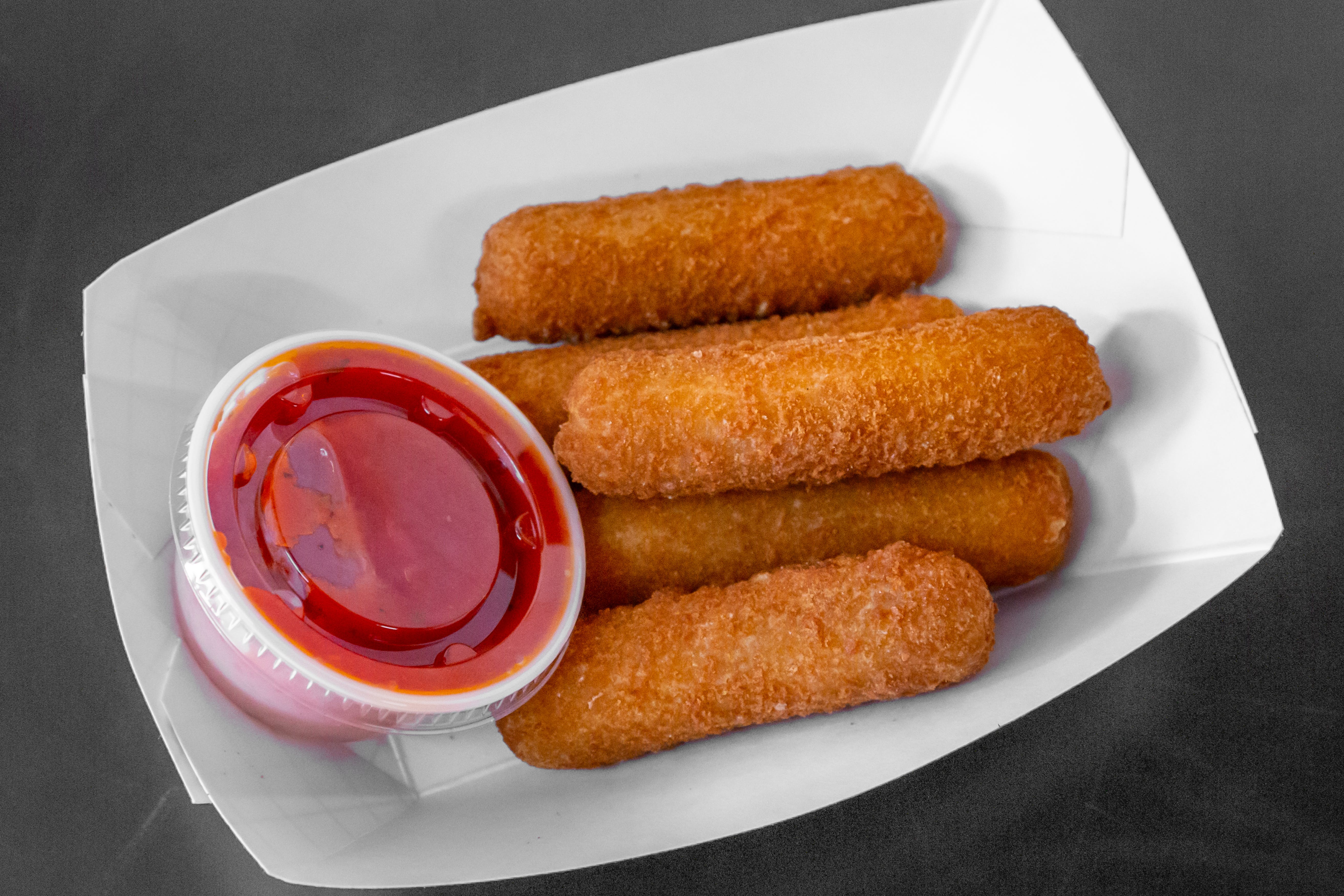 Order Mozzarella Sticks - 5 Pieces food online from New York Pizzeria & Catering store, Dobson on bringmethat.com