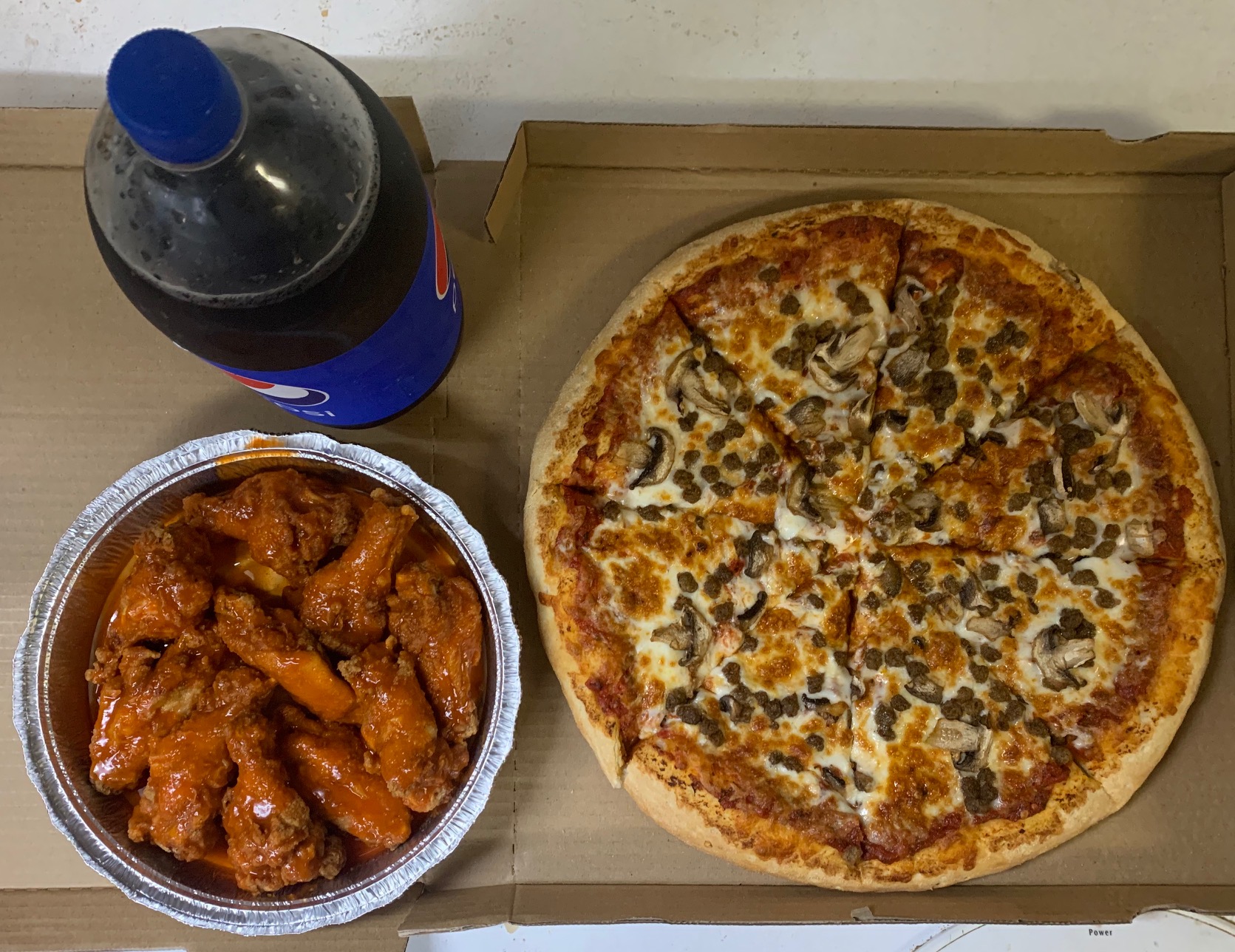 Order 1 large 2 topping pizza 10 wings and free 2 LT soda food online from Rice N Spice store, Lodi on bringmethat.com