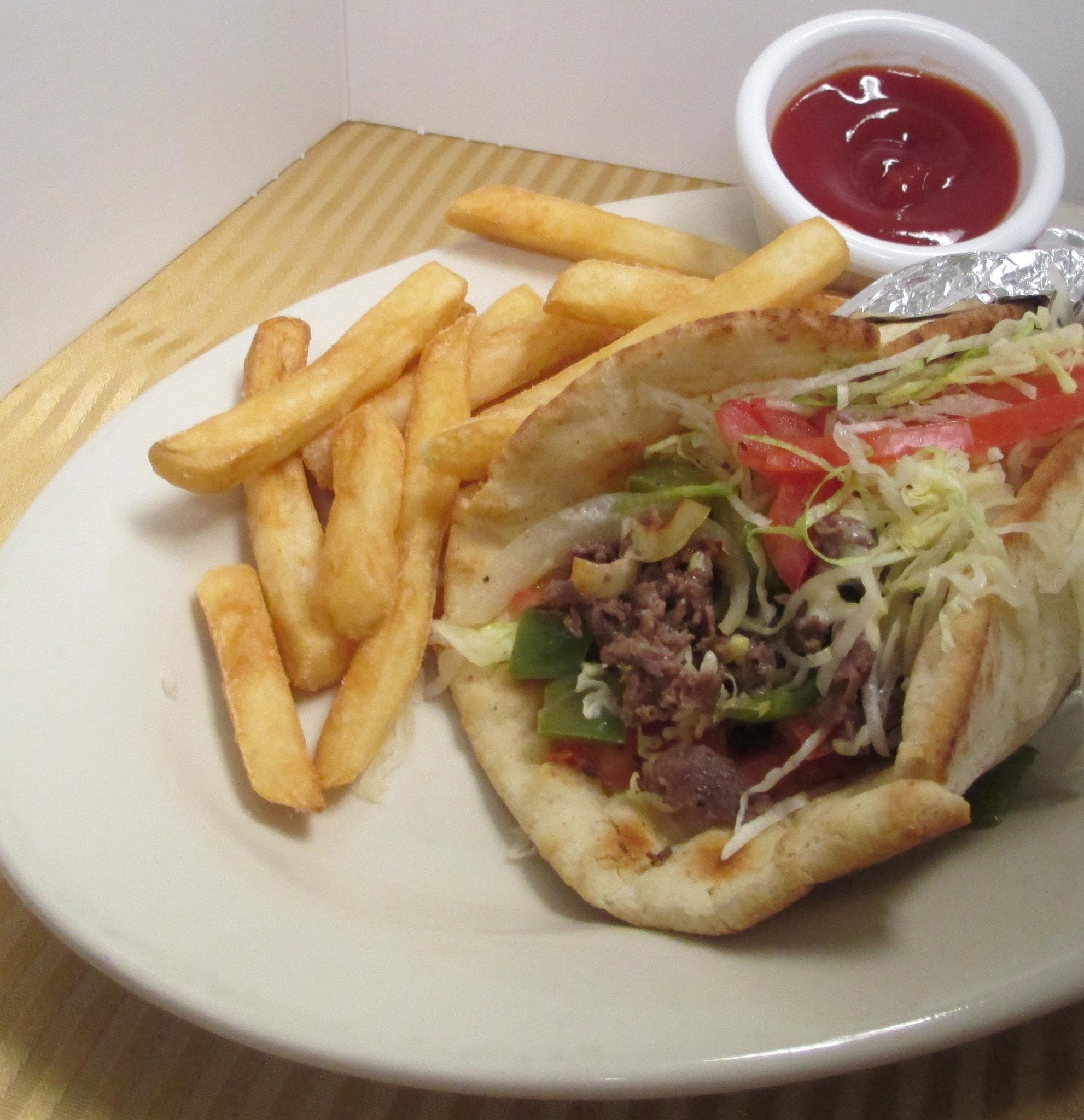 Order Gyro with Chips - Gyro food online from Stella Mia Pizzeria store, Staunton on bringmethat.com