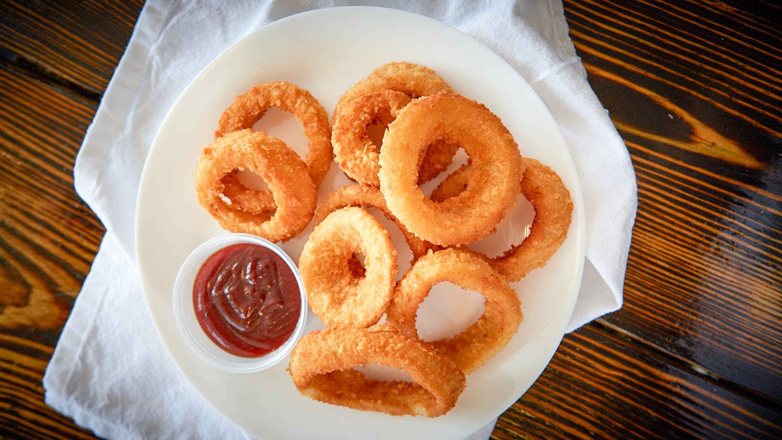 Order Onion Rings - Appetizer food online from Flamez wood fired pizza store, Blackwood on bringmethat.com