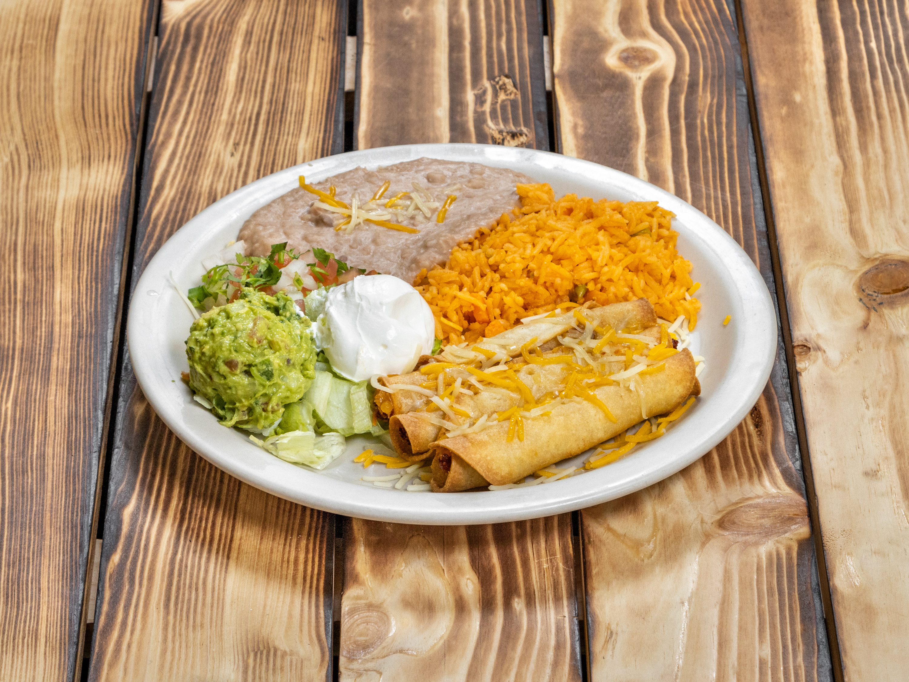 Order Flautas Lunch food online from Restaurant Y Tacos El Chino store, Dallas on bringmethat.com