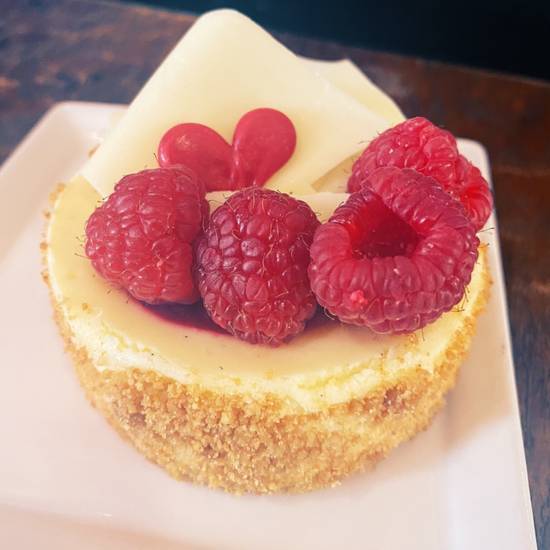 Order  Gluten Free White Chocolate Raspberry Cheesecake food online from Sinners & Saints Bakery store, Los Angeles on bringmethat.com