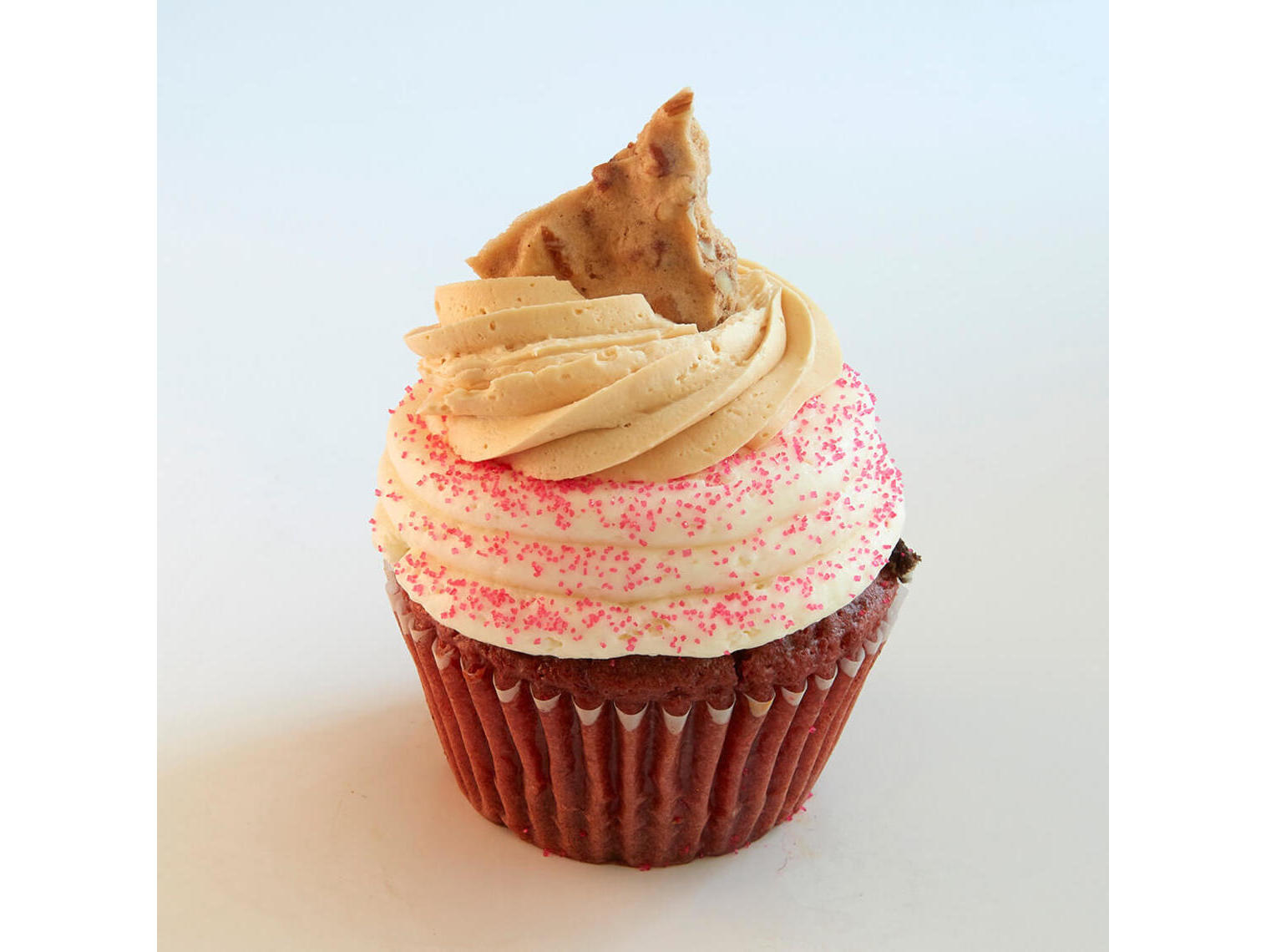 Order Twisted Pink Velvet Cupcake food online from Jilly Cupcake Bar & Ice Cream store, St. Louis on bringmethat.com