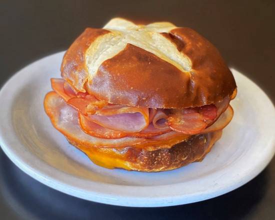 Order Pretzel bun sandwich - club food online from Sweetwaters Coffee & Tea store, Scottsdale on bringmethat.com