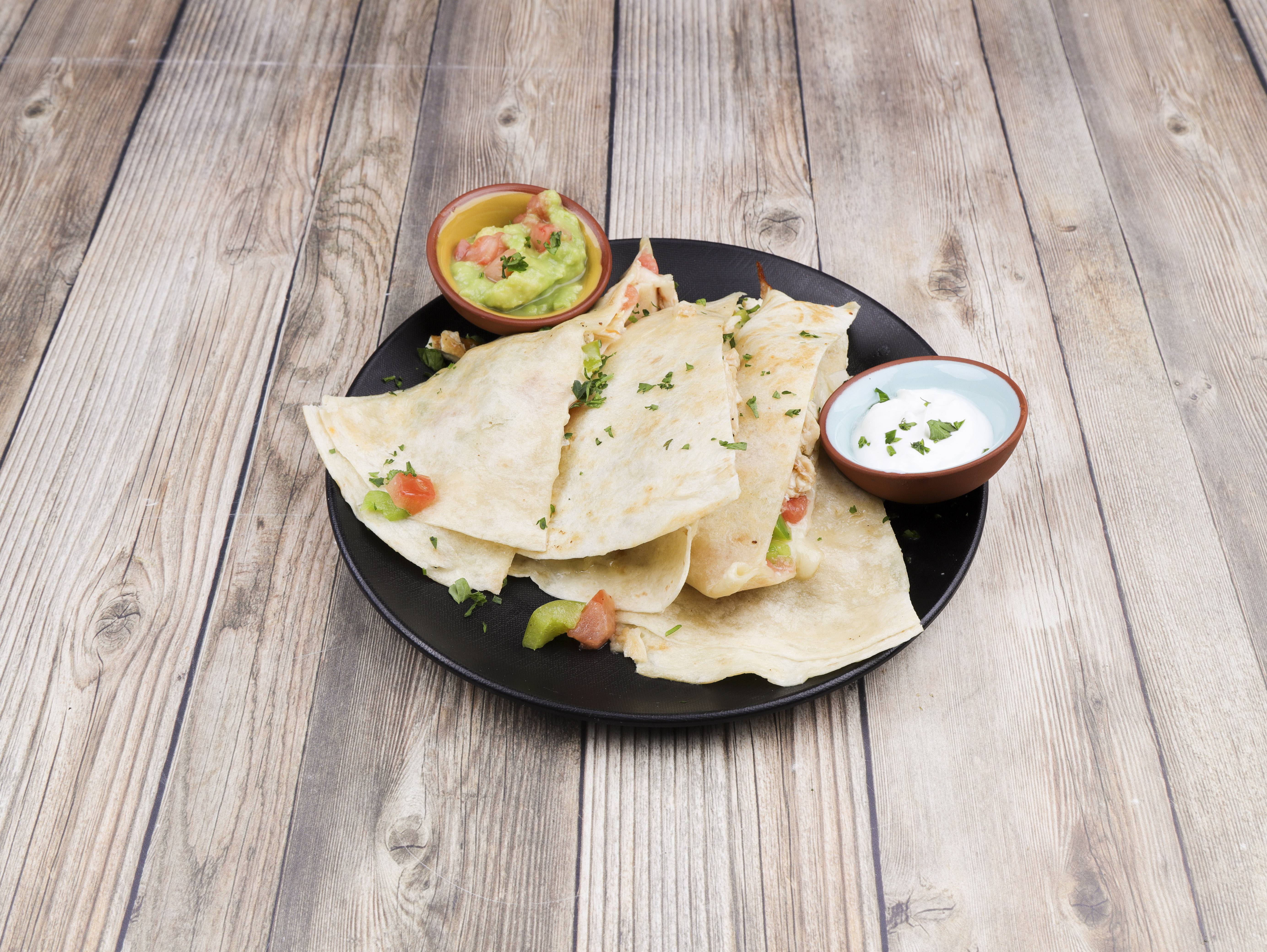 Order Quesadilla Grande with Meat food online from Tixteco Mexican Restaurant store, Omaha on bringmethat.com