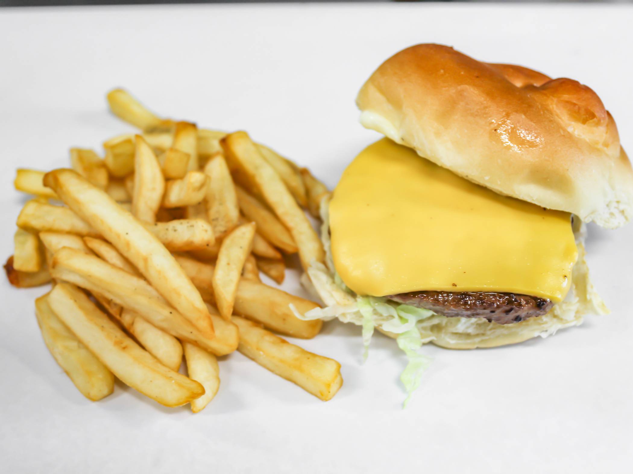 Order Cheeseburger with fries or onion rings 12 oz soda food online from Gate Express store, Rochester on bringmethat.com