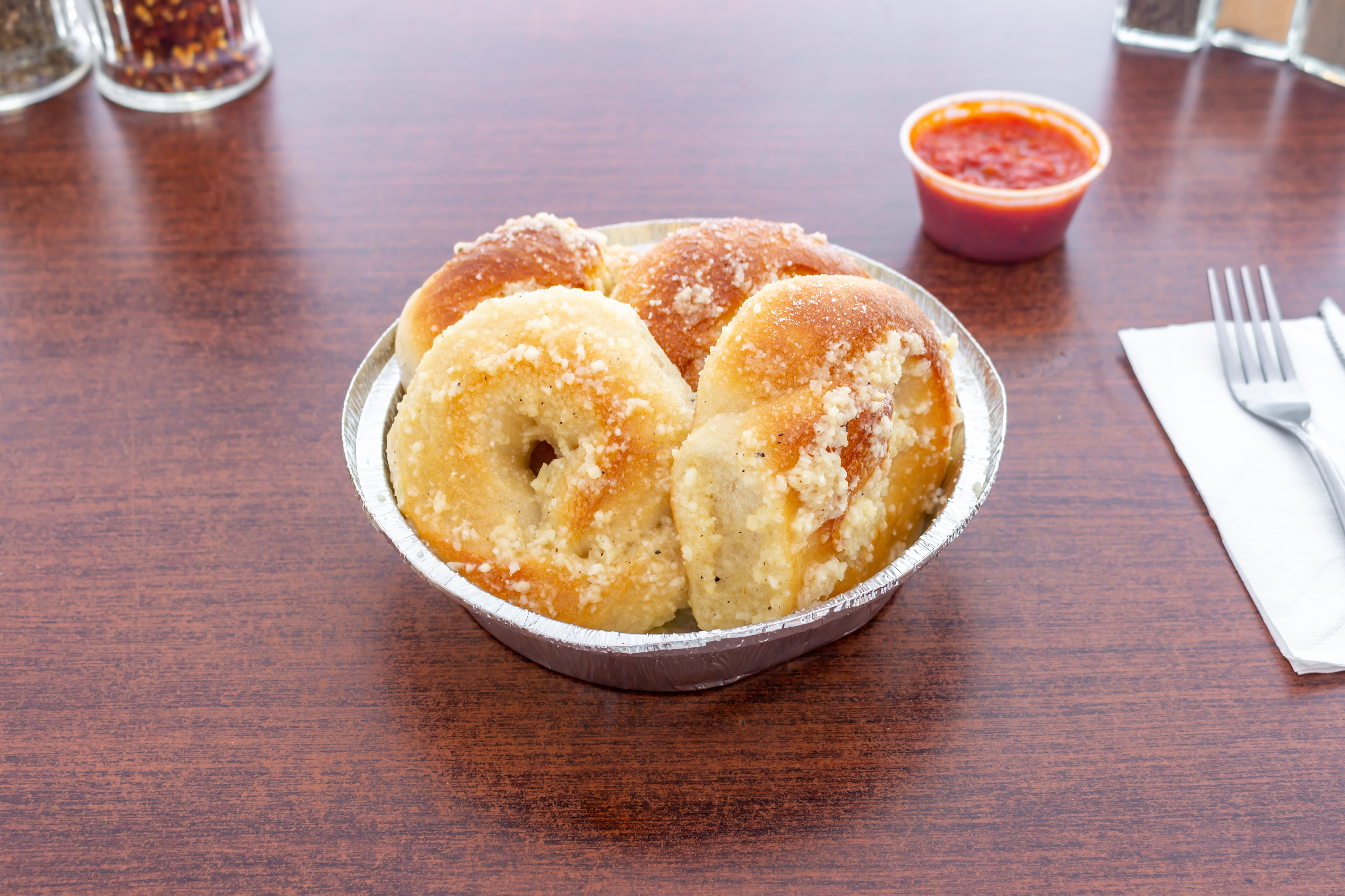 Order Garlic Knots - 4 Pieces food online from Sopranos Pizzeria store, New Milford on bringmethat.com