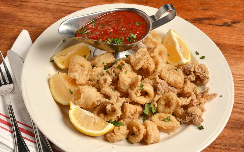 Order Fried Calamari food online from Cinelli's Pizza store, Franklin Square on bringmethat.com