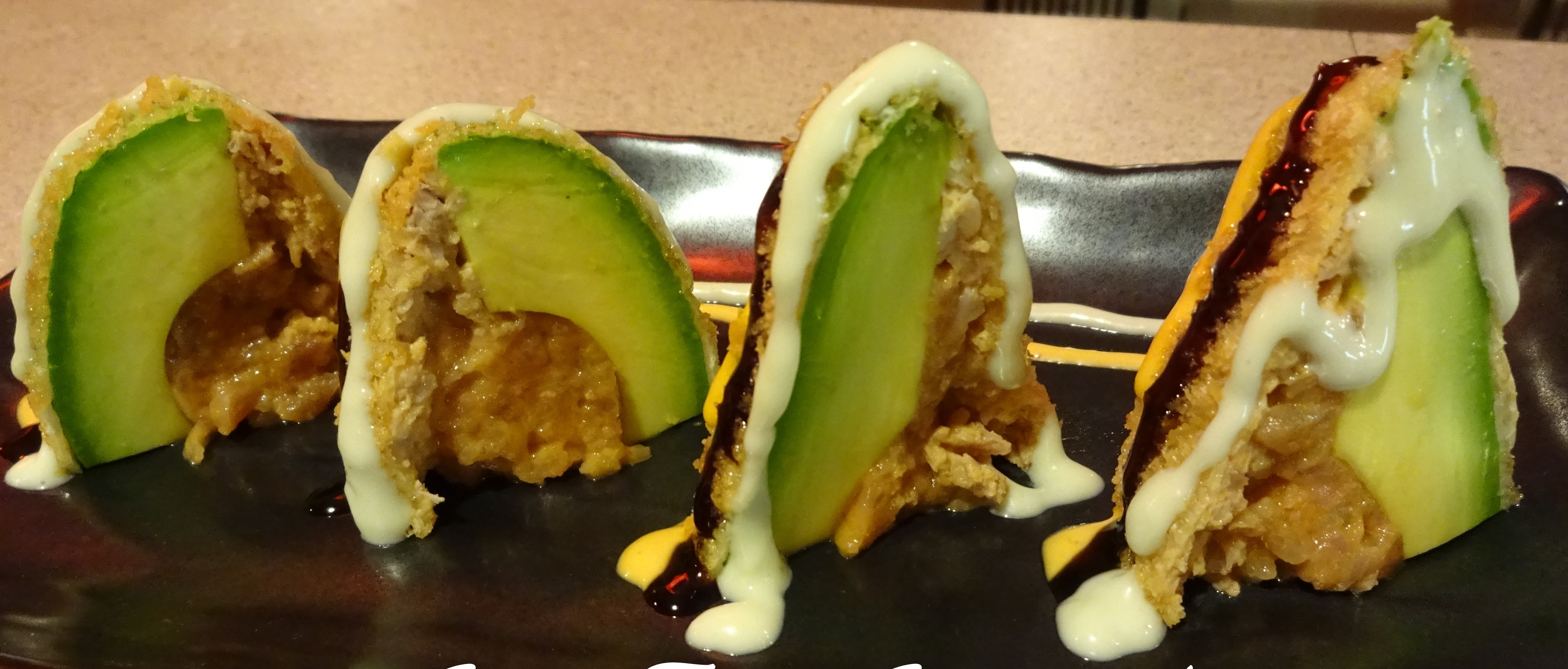 Order Spicy Tuna Stuffed Avocado food online from Musashi Exotic Japanese Cuisine store, Feasterville-Trevose on bringmethat.com