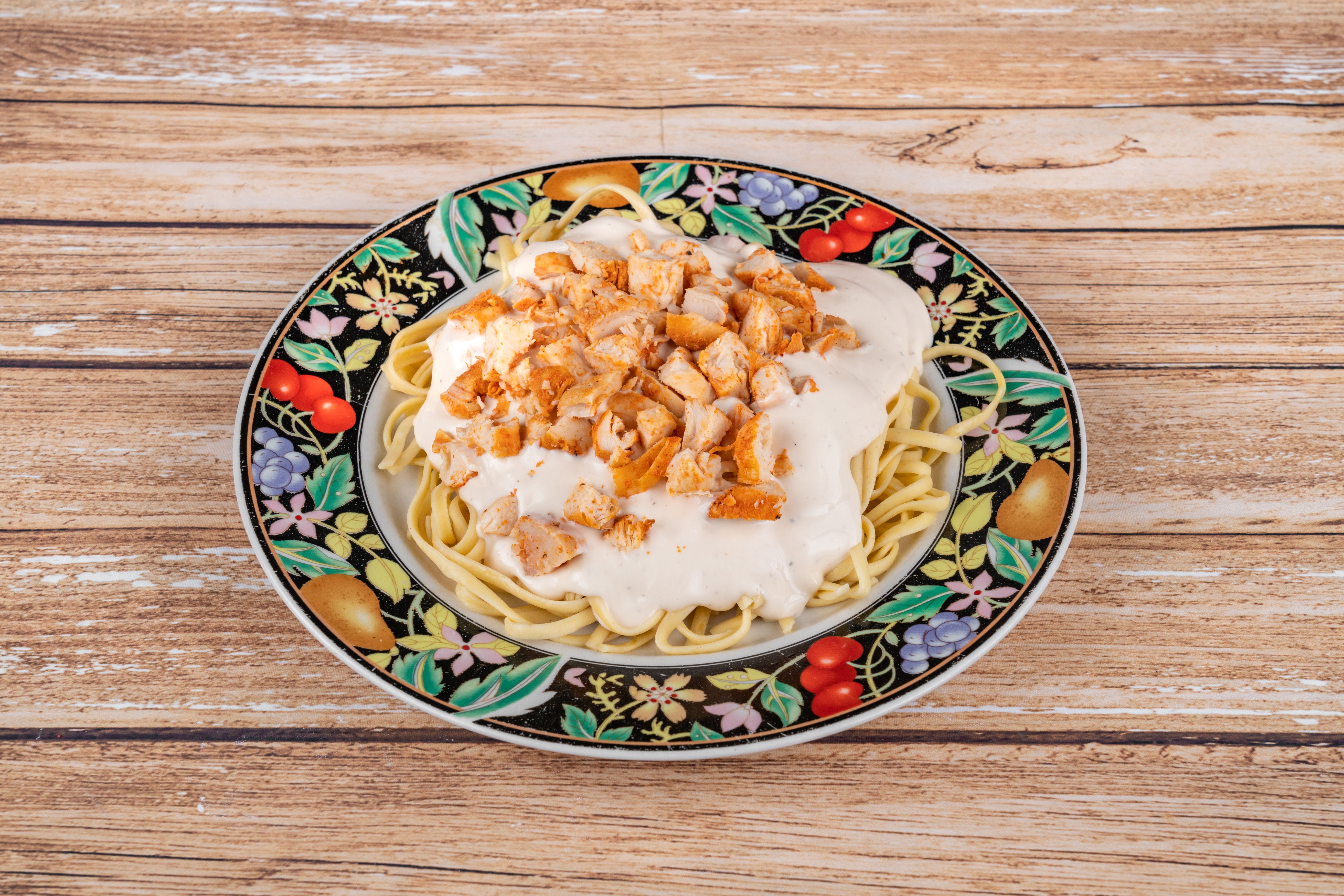 Order Fettuccine with Chicken - Pasta food online from Angelo's Pizza store, Houston on bringmethat.com