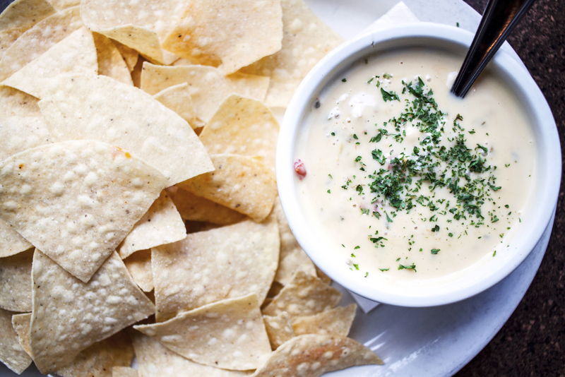 Order Chips & Queso food online from Press Box Grill store, Dallas on bringmethat.com