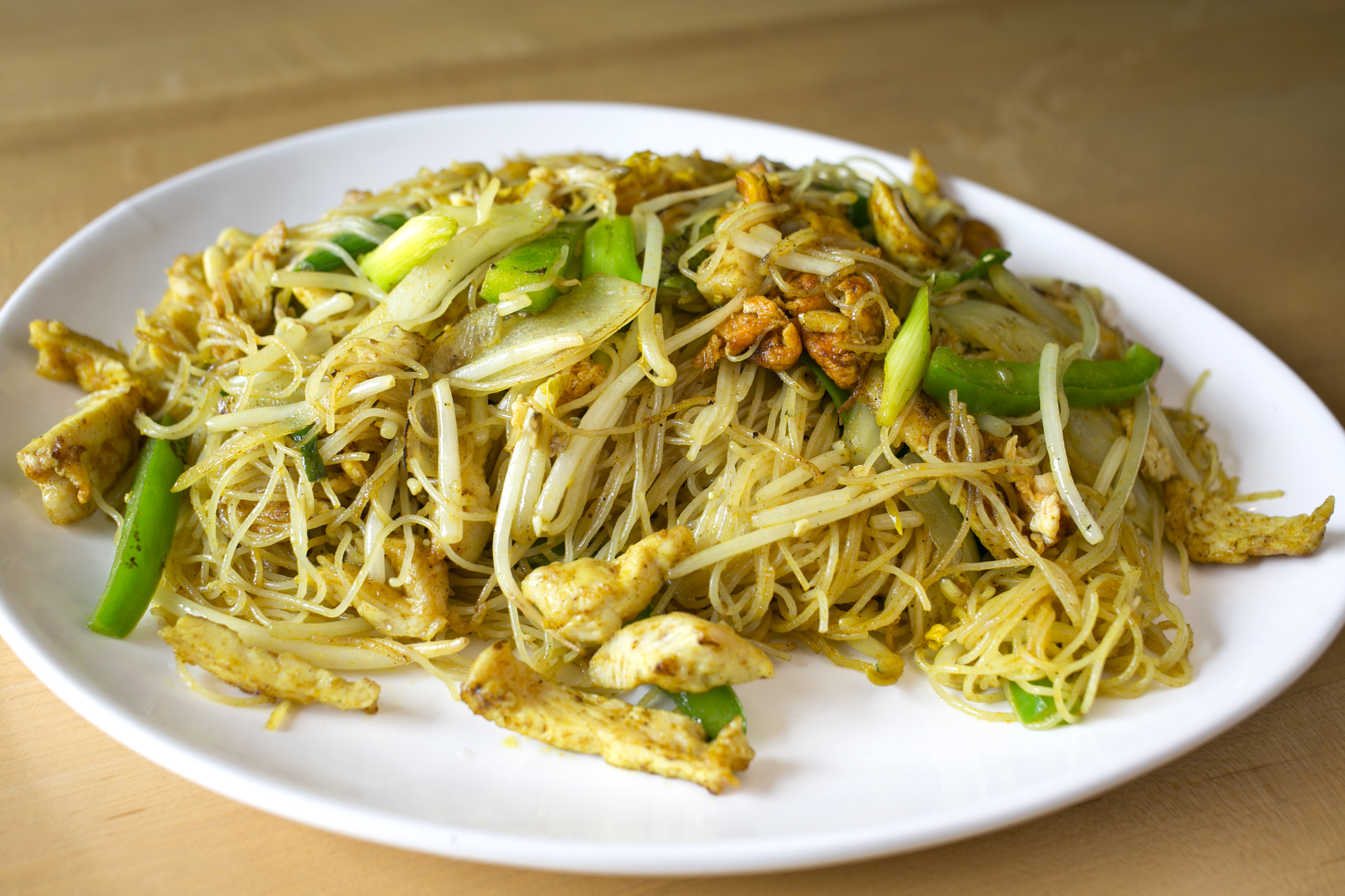 Order Singapore Noodles food online from Serai store, Chicago on bringmethat.com