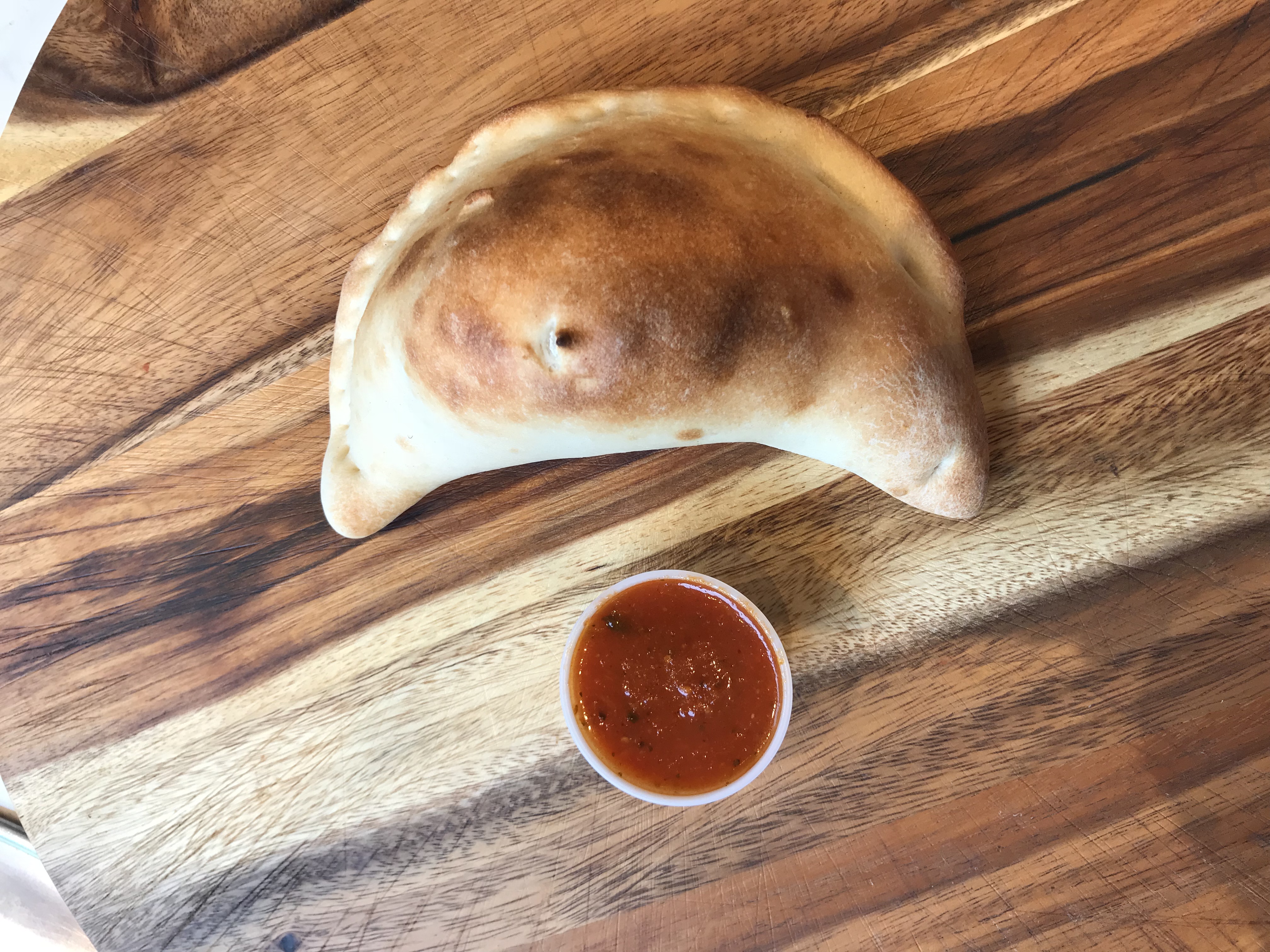 Order Cheese Calzone food online from Famous Calabria store, New York on bringmethat.com